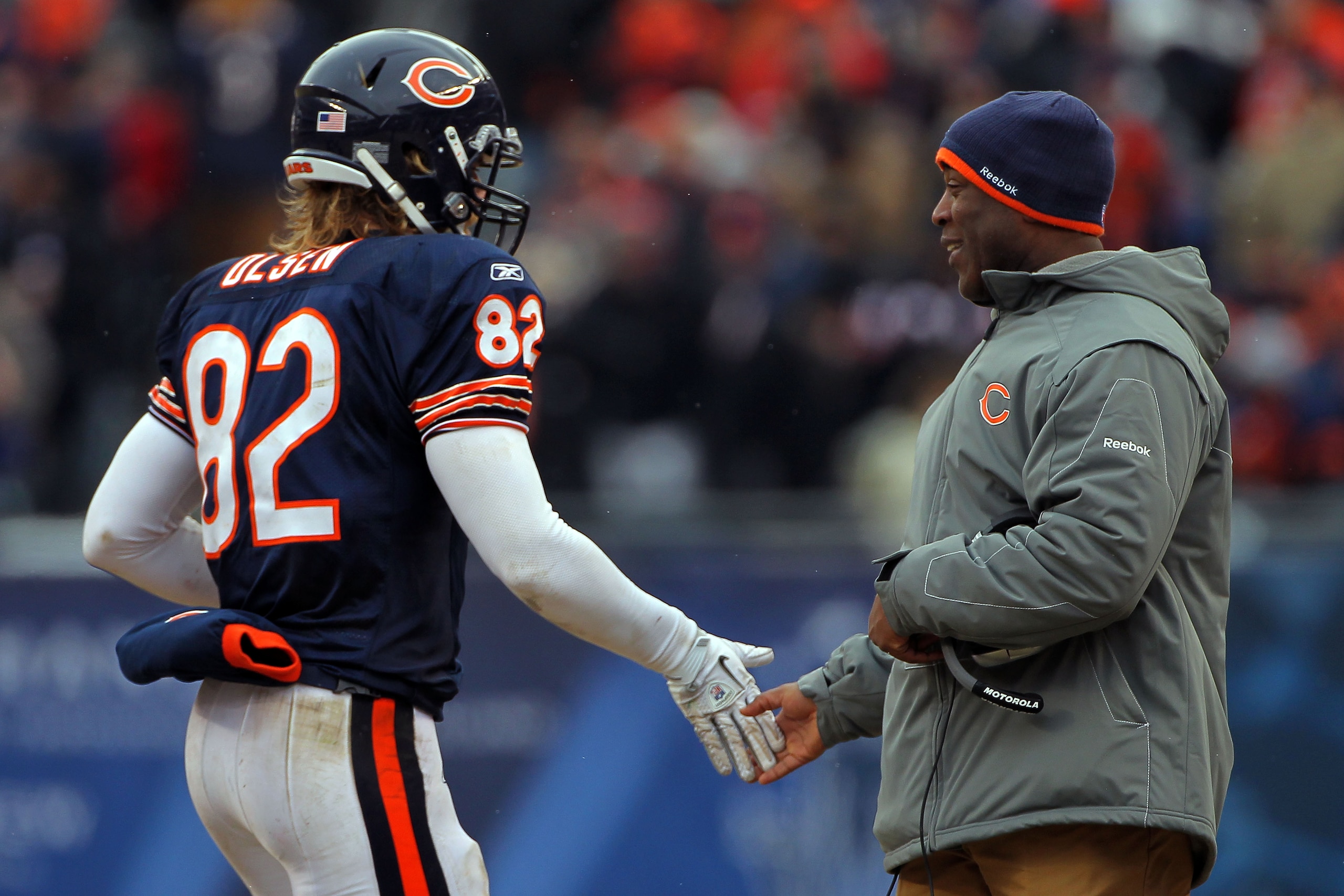 CHICAGO, IL - JANUARY 16:  Tight end Greg Olsen #82 of the Chicago Bears celebrates a third quarter touchdown by Jay Cutler #6 with head coach Lovie Smith against the Seattle Seahawks in the 2011 NFC divisional playoff game at Soldier Field on January 16,