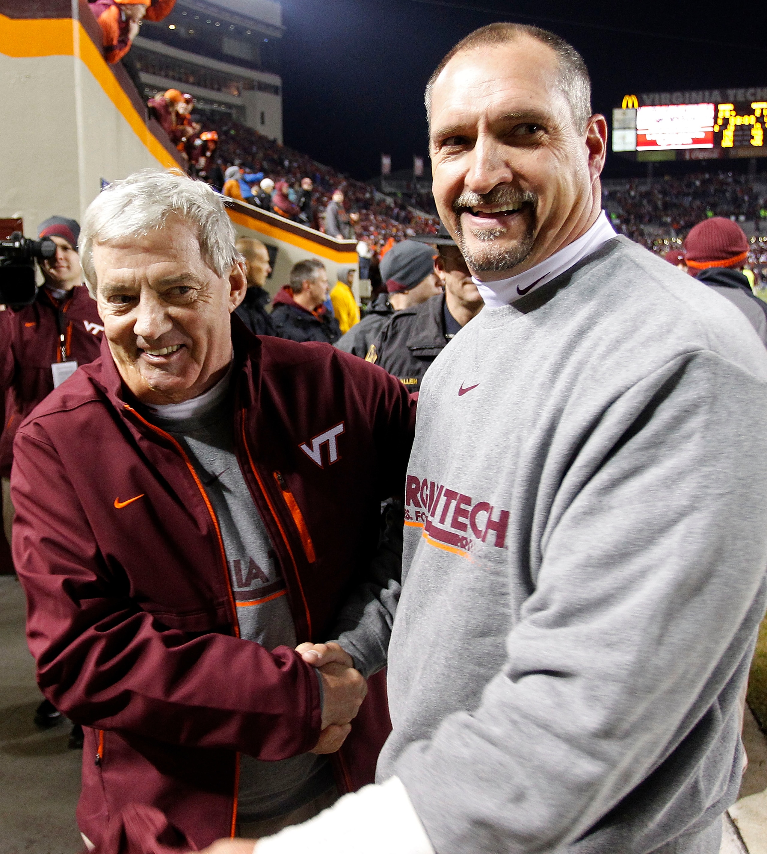 BLACKSBURG, VA - NOVEMBER 04: Head coach Frank Beamer (L) of the Virginia Tech Hokies celebrates with defensive coordinator Bud Foster (R) after the Hokies defeated the Georgia Tech Yellow Jackets 28-21 at Lane Stadium on November 4, 2010 in Blacksburg, V