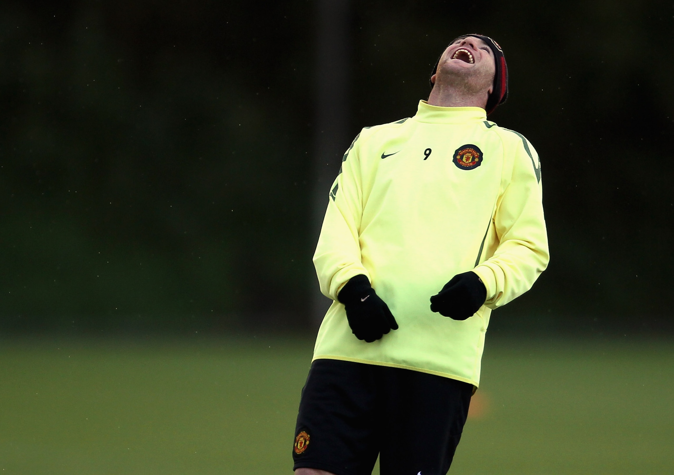 MANCHESTER, ENGLAND - OCTOBER 19:  Wayne Rooney of Manchester United enjoys a joke during a training session at the Carrington Training Complex on October 19, 2010 in Manchester, England.  (Photo by Alex Livesey/Getty Images)