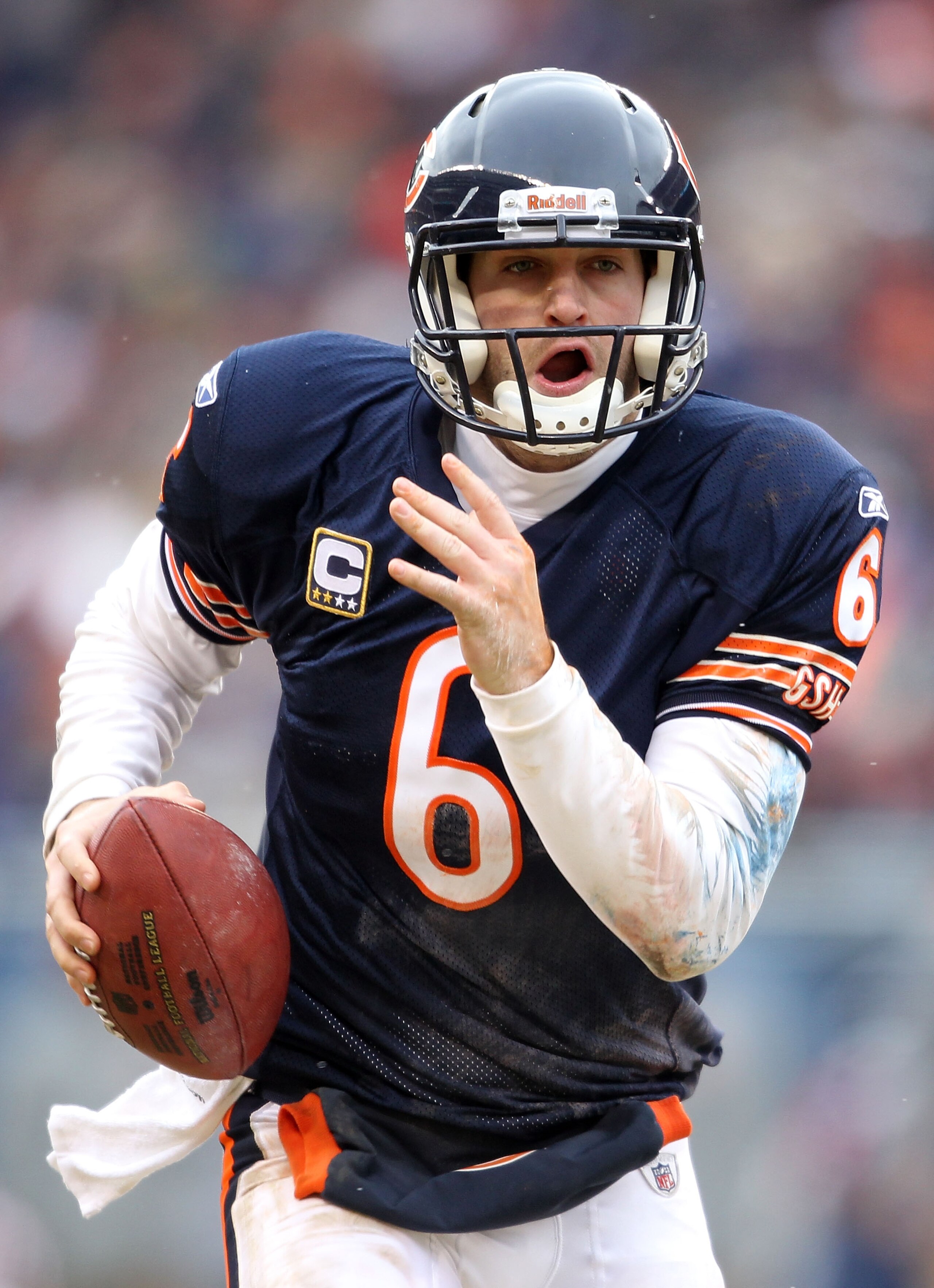 CHICAGO, IL - JANUARY 16:  Quarterback Jay Cutler #6 of the Chicago Bears runs the ball in the second half against the Seattle Seahawks in the 2011 NFC divisional playoff game at Soldier Field on January 16, 2011 in Chicago, Illinois.  (Photo by Andy Lyon