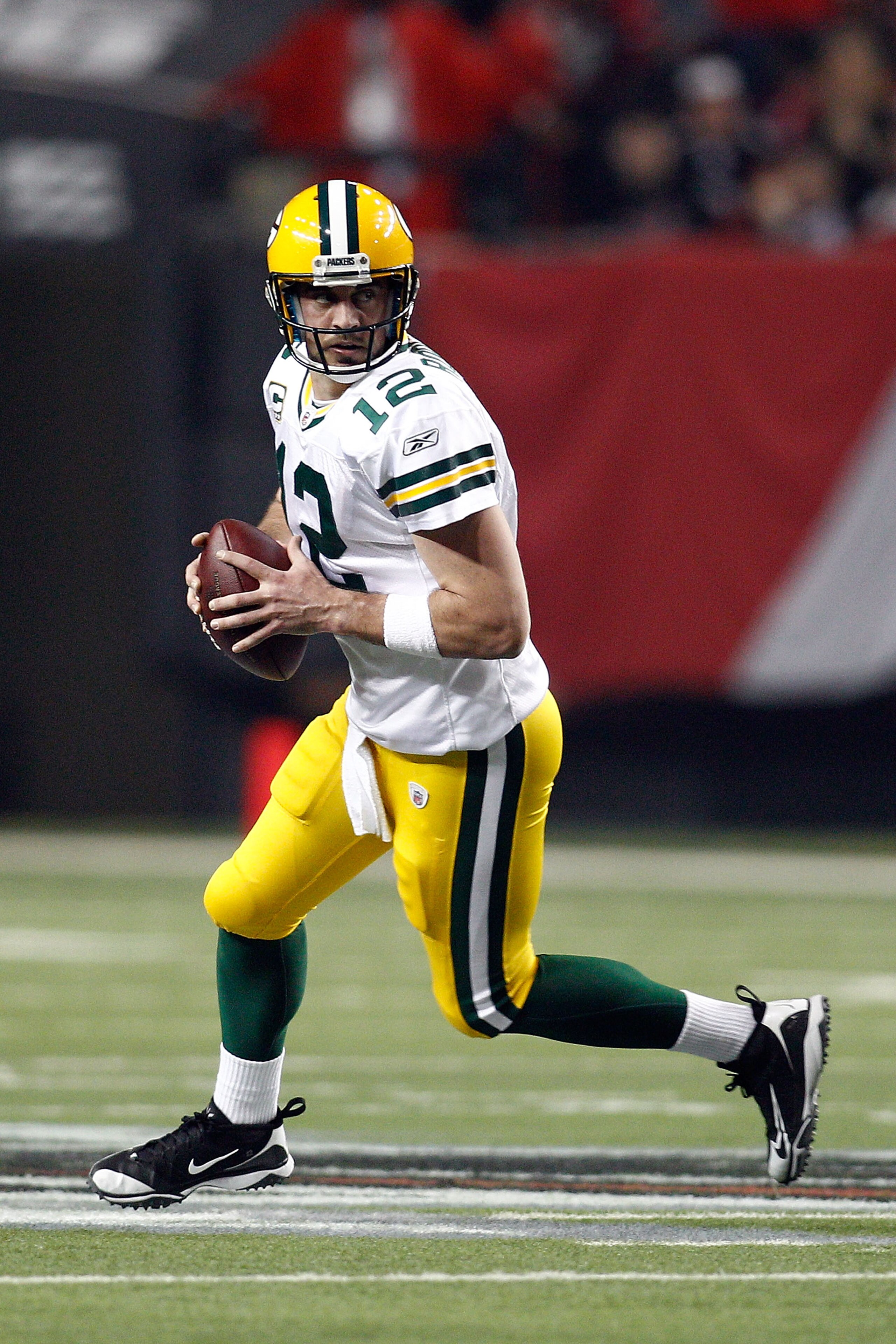 ATLANTA, GA - JANUARY 15:  Aaron Rodgers #12 of the Green Bay Packers looks to pass against the Atlanta Falcons during their 2011 NFC divisional playoff game at Georgia Dome on January 15, 2011 in Atlanta, Georgia. The Packers won 48-21. (Photo by Chris G