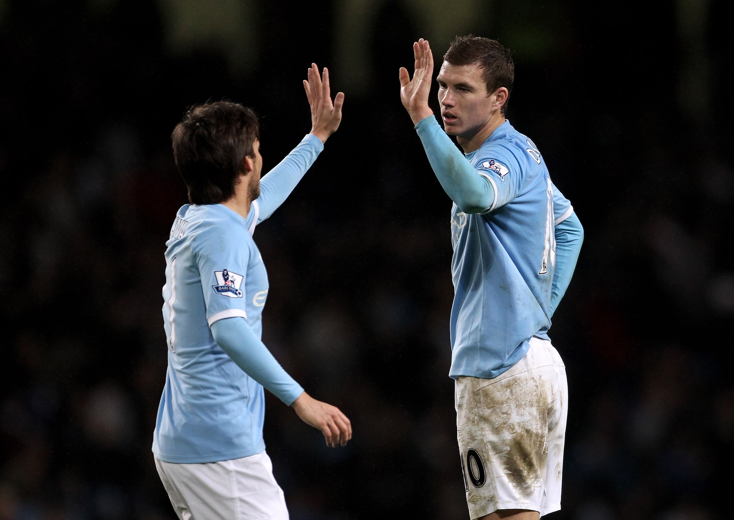 MANCHESTER, UNITED KINGDOM - JANUARY 15:   Edin Dzeko of Manchester City celebrates with team mate David Silva (L) at the end of the Barclays Premier League match between Manchester City and Wolverhampton Wanderers at the City of Manchester Stadium on Jan
