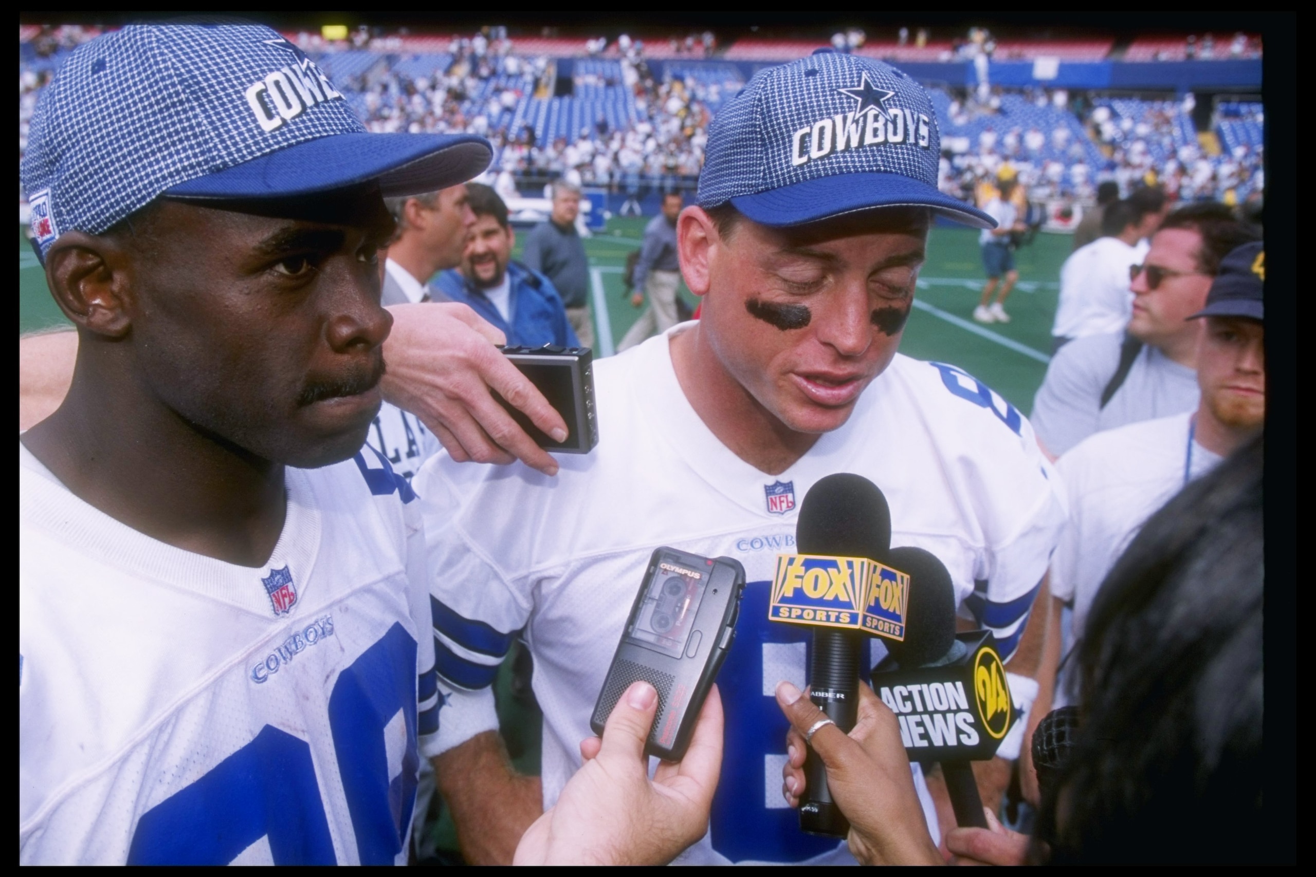 31 Aug 1997:  Quarterback Troy Aikman and wide receiver Michael Irvin get interviewed after a game against the Pittsburgh Steelers at Three Rivers Stadium in Pittsburgh, Pennsylvania.  The Cowboys won the game, 37-7. Mandatory Credit: Stephen Dunn  /Allsp
