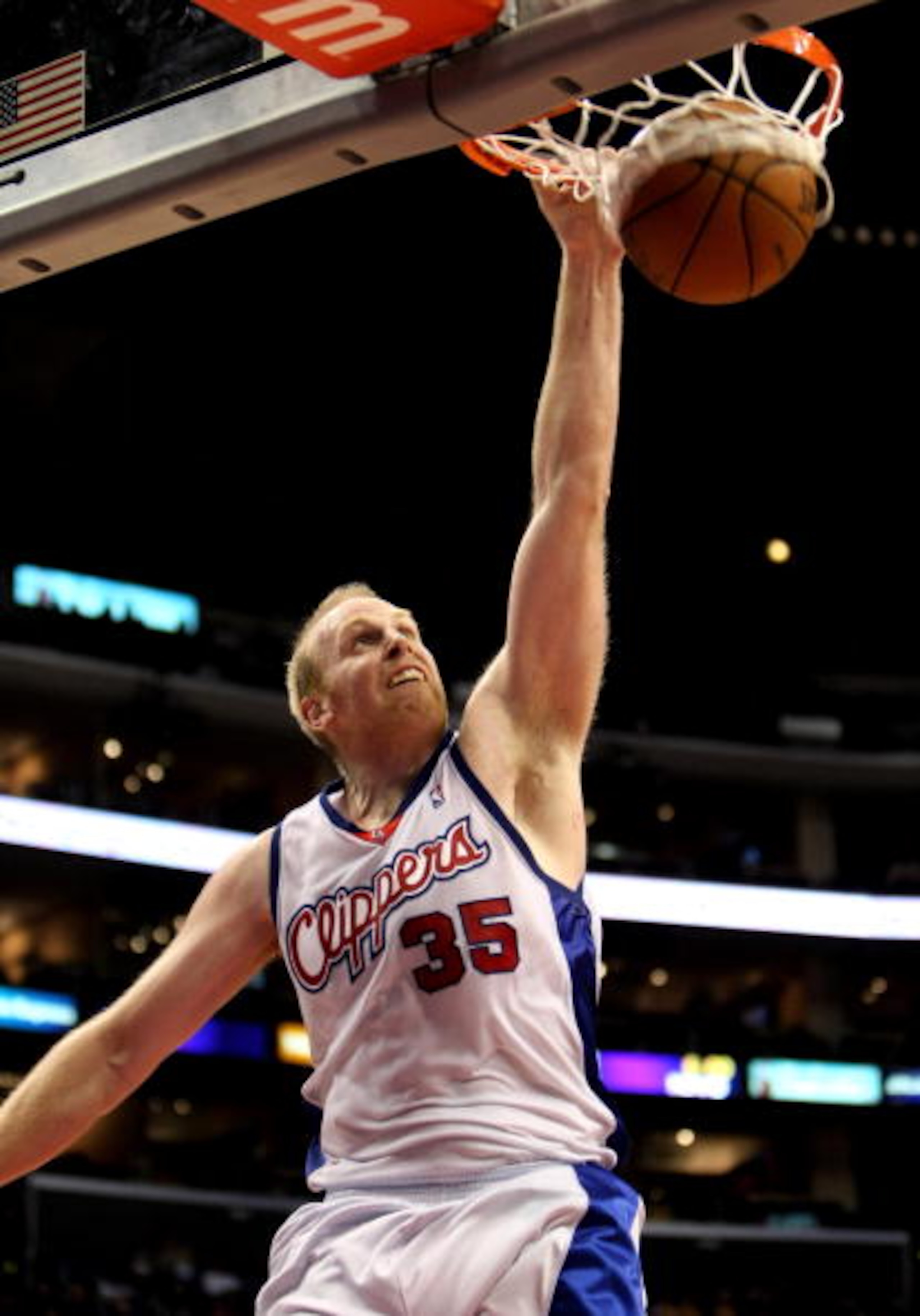 LOS ANGELES, CA - JANUARY 18: Chris Kaman #35 of the Los Angeles Clippers dunks against the the New Jersey Nets on January 18, 2010 at Staples Center in Los Angeles, California. The Clippers won 106-95. NOTE TO USER: User expressly acknowledges and agre LOS ANGELES, CA - JANUARY 18: Chris Kaman #35 of the Los Angeles Clippers dunks against the the New Jersey Nets on January 18, 2010 at Staples Center in Los Angeles, California. The Clippers won 106-95. NOTE TO USER: User expressly acknowledges and agre