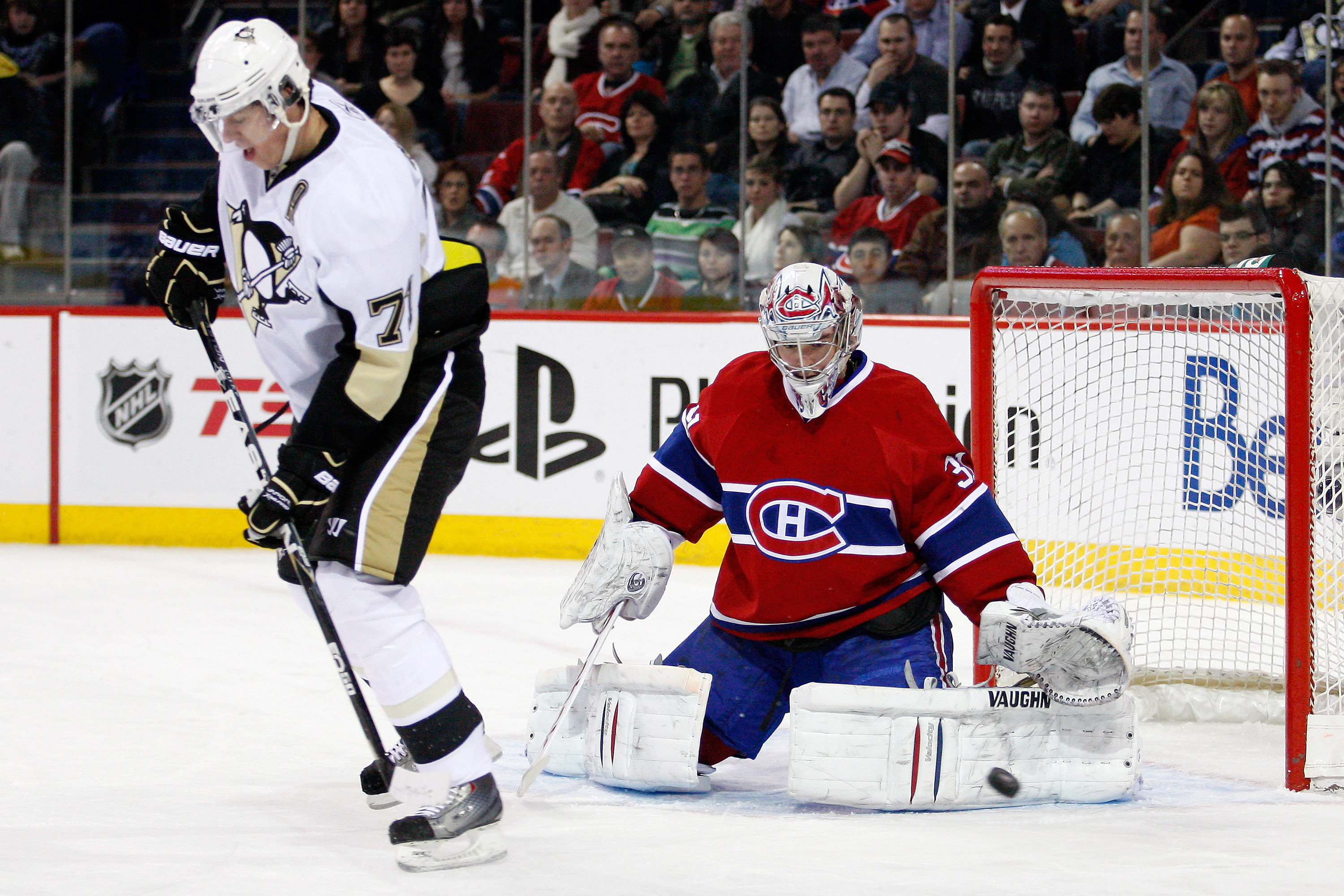 MONTREAL, CANADA - JANUARY 12:  Carey Price #31 of the Montreal Canadiens gets down to stop the puck deflected by Evgeni Malkin #71 of the Pittsburgh Penguins during the NHL game at the Bell Centre on January 12, 2011 in Montreal, Quebec, Canada.  (Photo