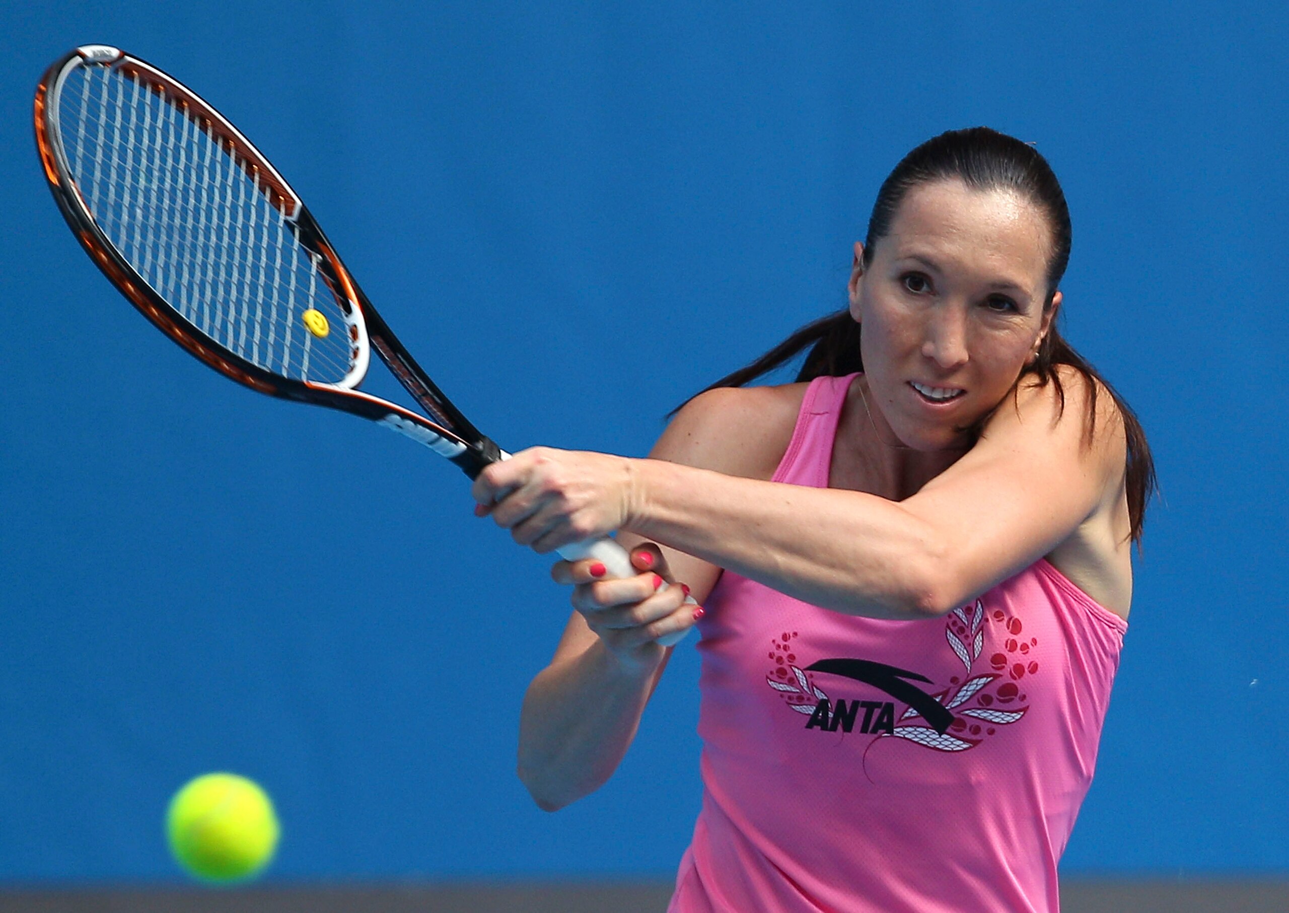 MELBOURNE, AUSTRALIA - JANUARY 14:  Jelena Jankovic of Serbia hits a backhand shot during a practice session ahead of the 2011 Australian Open at Melbourne Park on January 14, 2011 in Melbourne, Australia.  (Photo by Lucas Dawson/Getty Images)