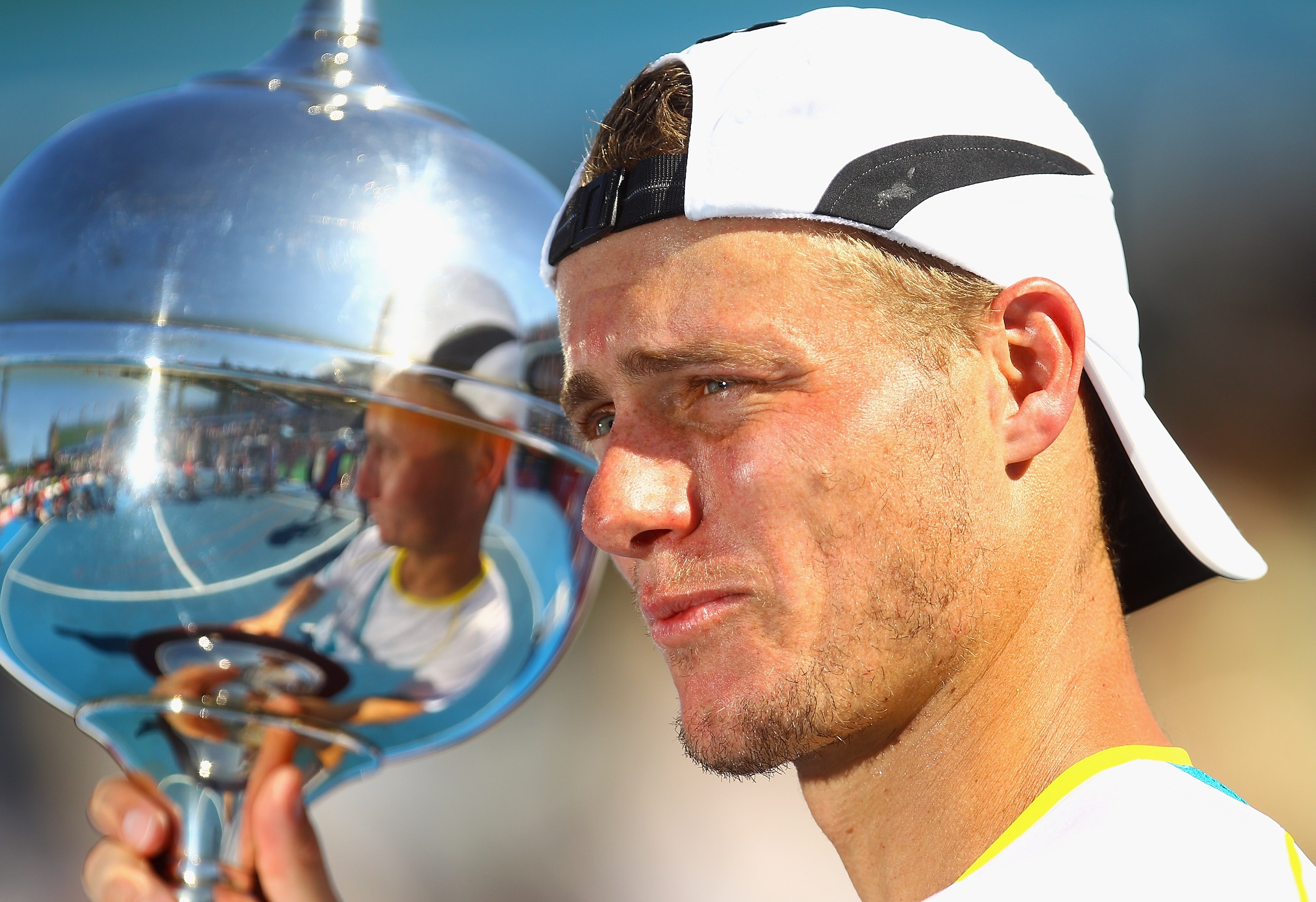 MELBOURNE, AUSTRALIA - JANUARY 15:  Lleyton Hewitt of Australia holds aloft the trophy after winning his match against Gael Monfils of France during day four of the AAMI Classic at Kooyong on January 15, 2011 in Melbourne, Australia.  (Photo by Quinn Roon
