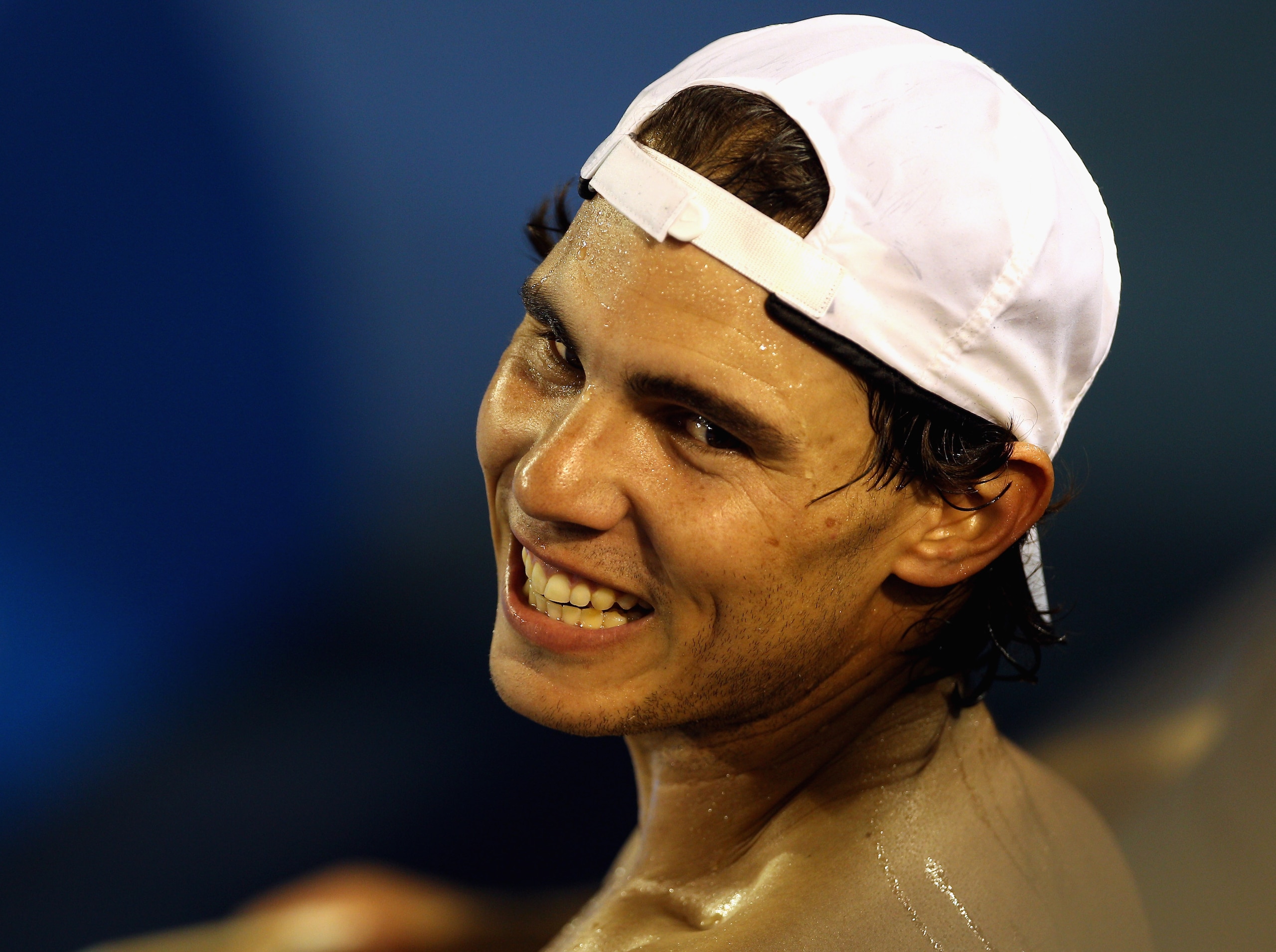 MELBOURNE, AUSTRALIA - JANUARY 13:  Rafael Nadal of Spain shares a laugh with his training staff during a practice session ahead of the 2011 Australian Open at Melbourne Park on January 13, 2011 in Melbourne, Australia.  (Photo by Mark Dadswell/Getty Imag