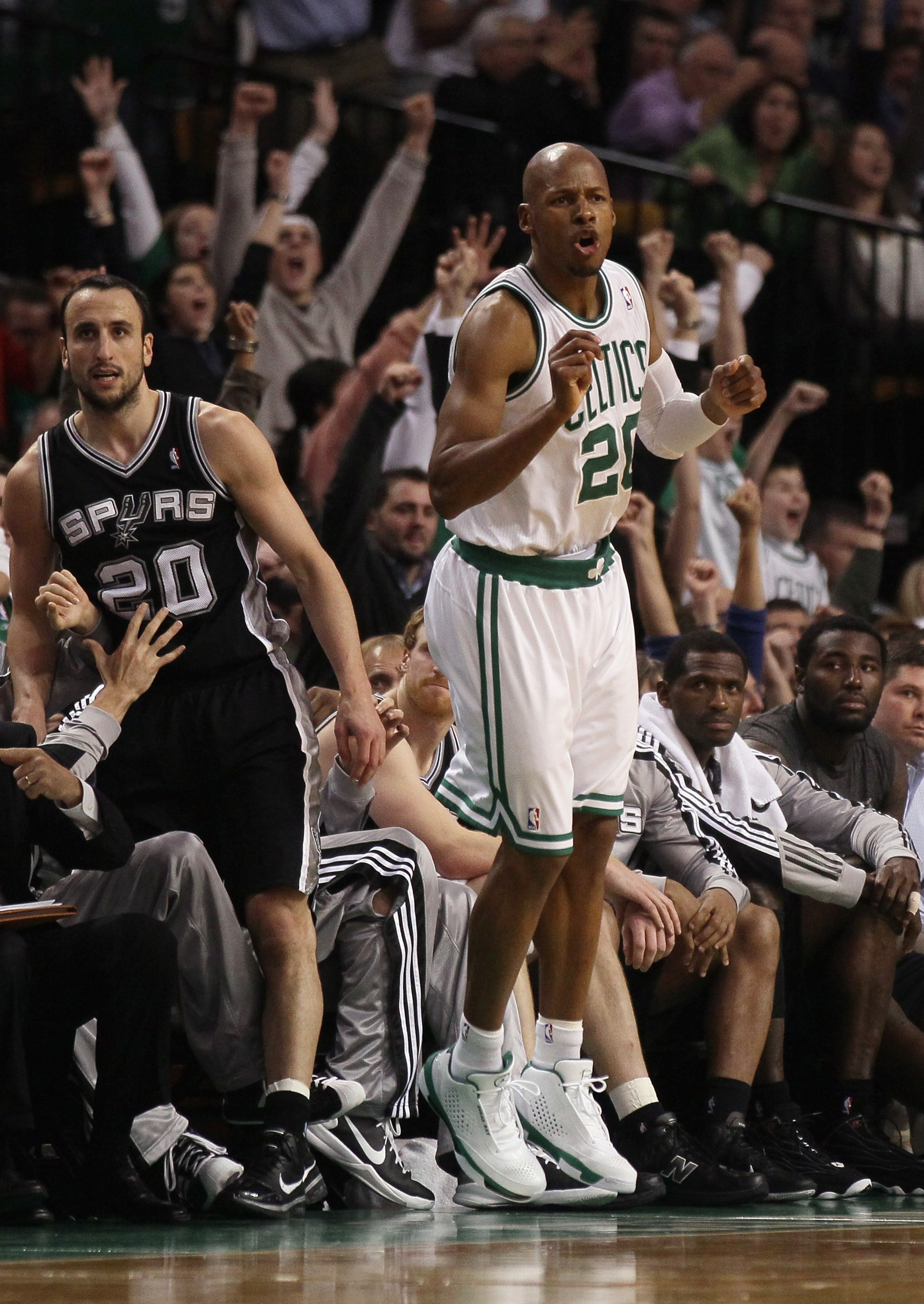 BOSTON, MA - JANUARY 05:  Ray Allen #20 of the Boston Celtics celebrates his three point shot in the fourth quarter as Manu Ginobili #20 of the San Antonio Spurs stands by on January 5, 2011 at the TD Garden in Boston, Massachusetts. The Celtics defeated