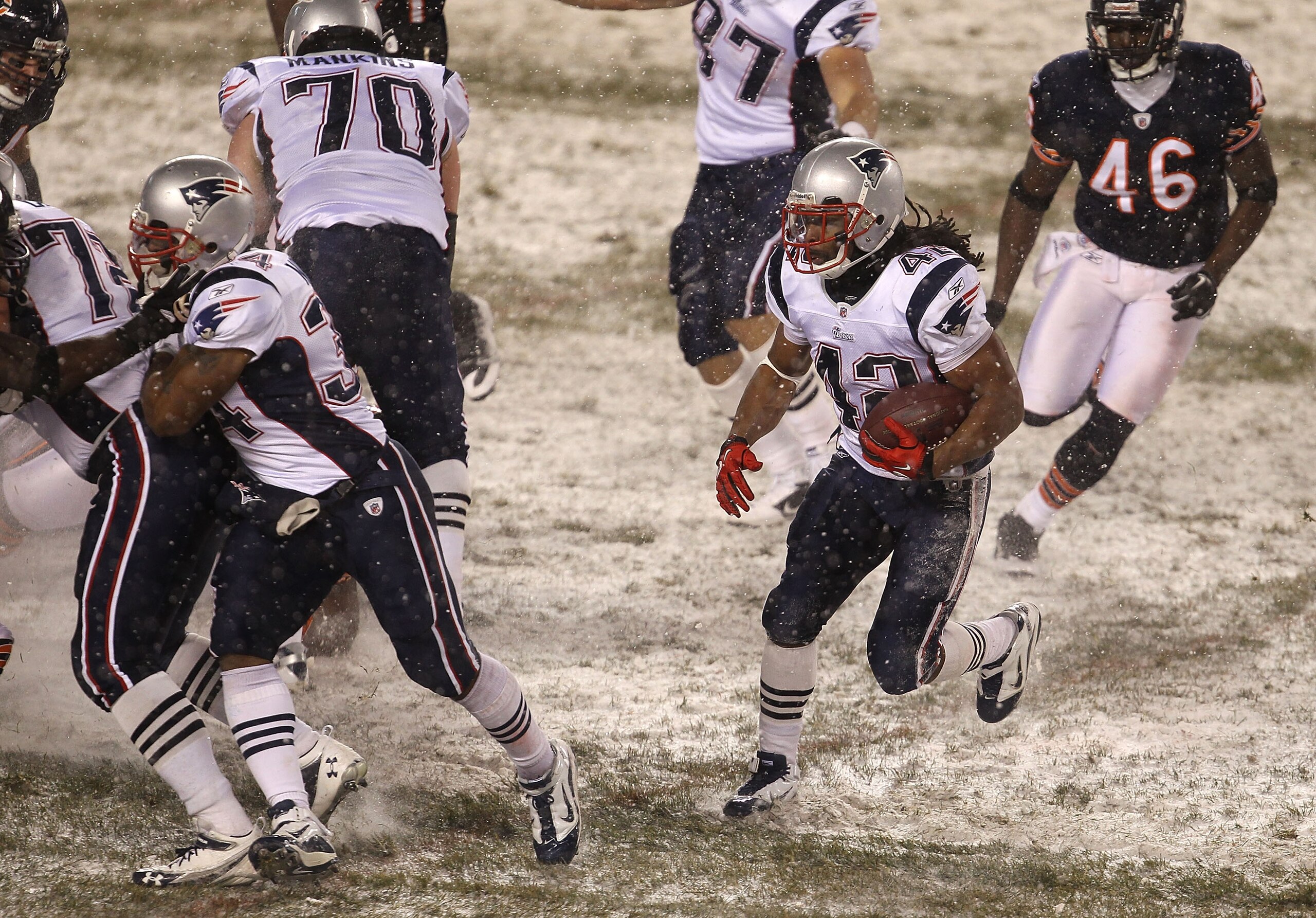 CHICAGO, IL - DECEMBER 12: Ben-Jarvus Green-Ellis #42 of the New England Patriots looks for running room pursued by Chris Harris #46 of the Chicago Bears at Soldier Field on December 12, 2010 in Chicago, Illinois. The Patriots defeated the Bears 36-7. (Ph