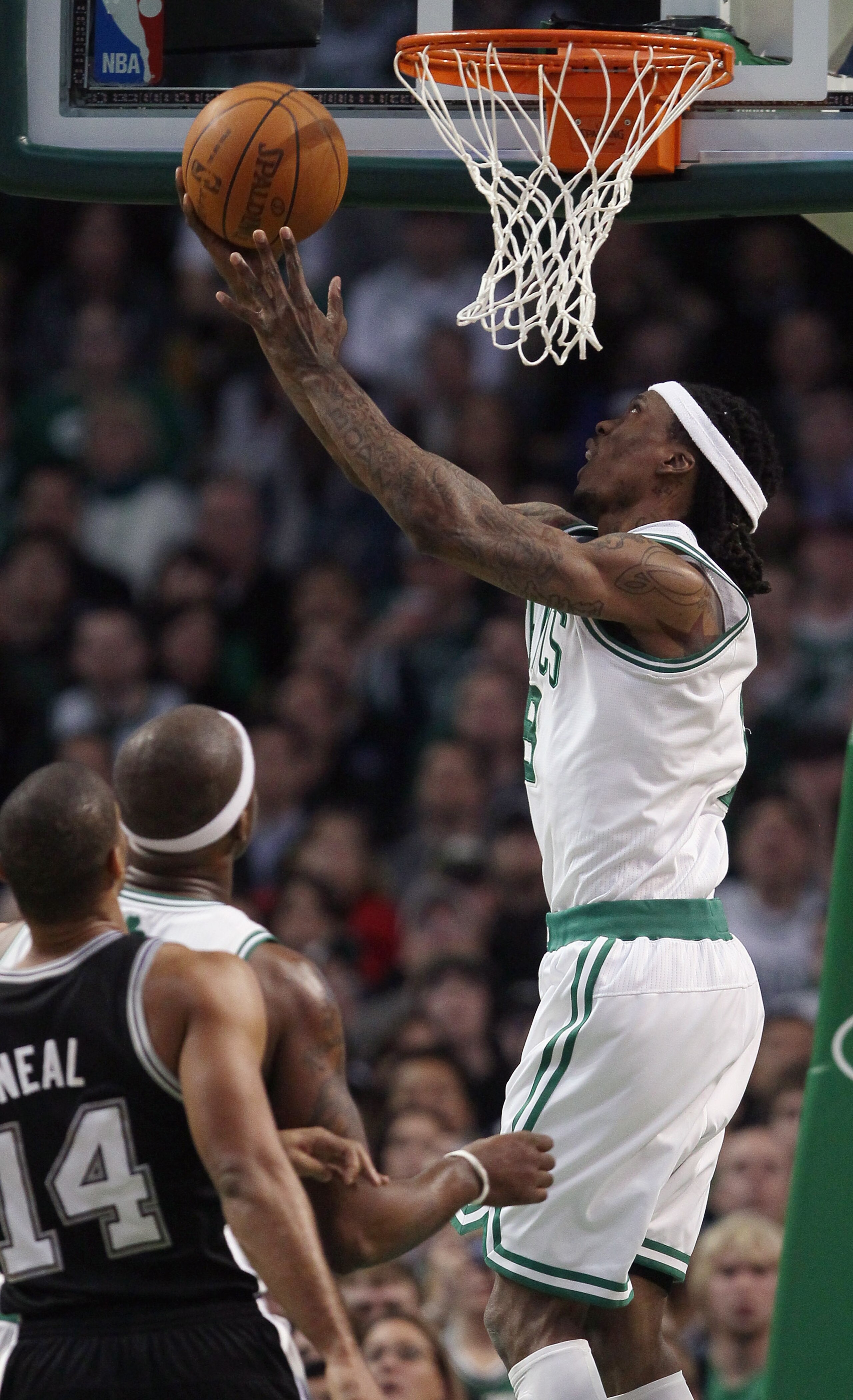 BOSTON, MA - JANUARY 05:  Marquis Daniels #8 of the Boston Celtics takes a shot as Gary Neal #14 of the San Antonio Spurs defends on January 5, 2011 at the TD Garden in Boston, Massachusetts. The Celtics defeated the Spurs 105-103. NOTE TO USER: User expr