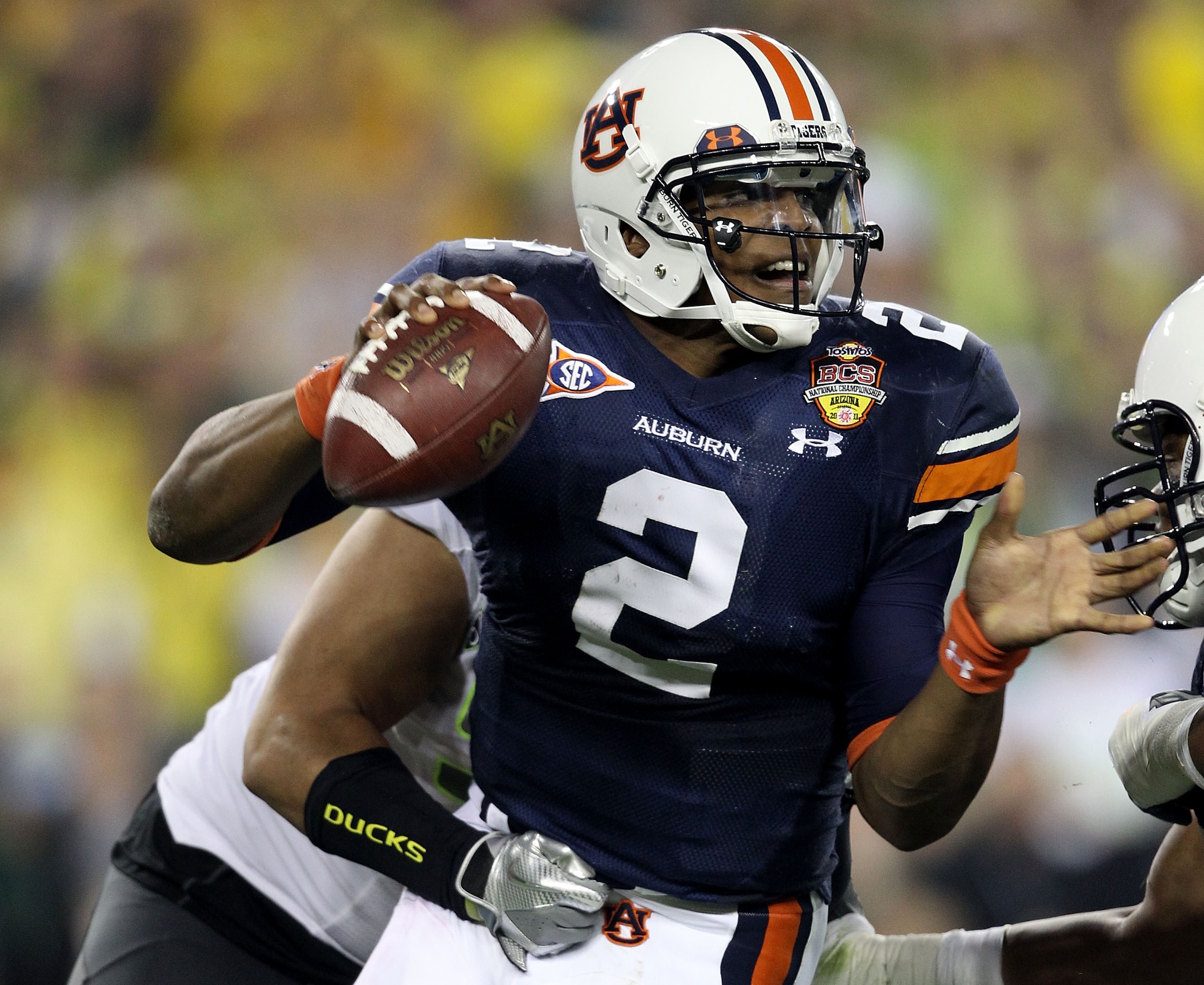 GLENDALE, AZ - JANUARY 10: Quarterback Cameron Newton #2 of the Auburn Tigers is sacked by Zac Clark #99 of the Oregon Ducks in the first quarter during the Tostitos BCS National Championship Game at University of Phoenix Stadium on January 10, 2011 in G GLENDALE, AZ - JANUARY 10: Quarterback Cameron Newton #2 of the Auburn Tigers is sacked by Zac Clark #99 of the Oregon Ducks in the first quarter during the Tostitos BCS National Championship Game at University of Phoenix Stadium on January 10, 2011 in G