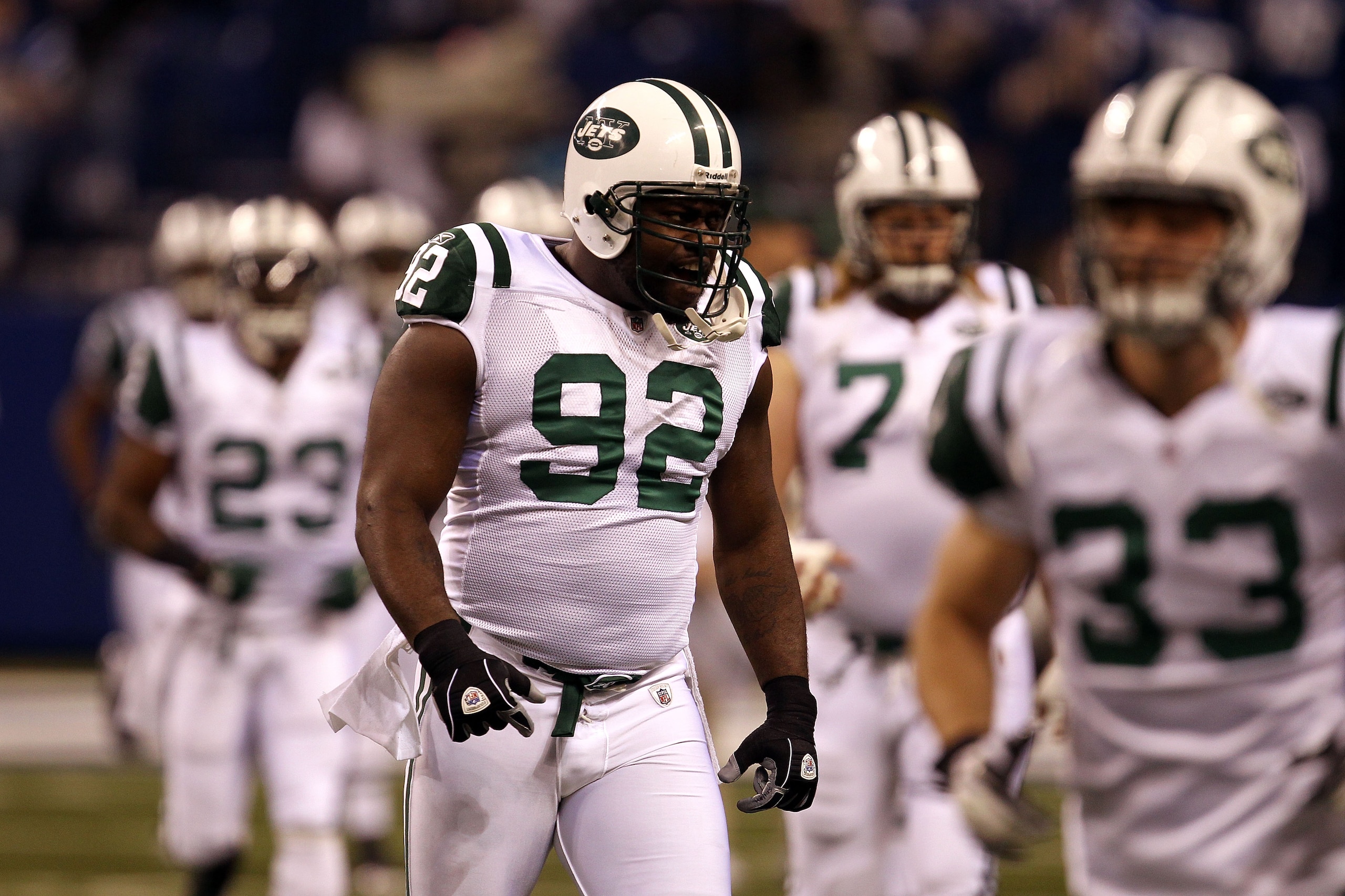INDIANAPOLIS, IN - JANUARY 08:  Shaun Ellis #92 of the New York Jets takes the field with his teammates to play against the Indianapolis Colts during their 2011 AFC wild card playoff game at Lucas Oil Stadium on January 8, 2011 in Indianapolis, Indiana. T