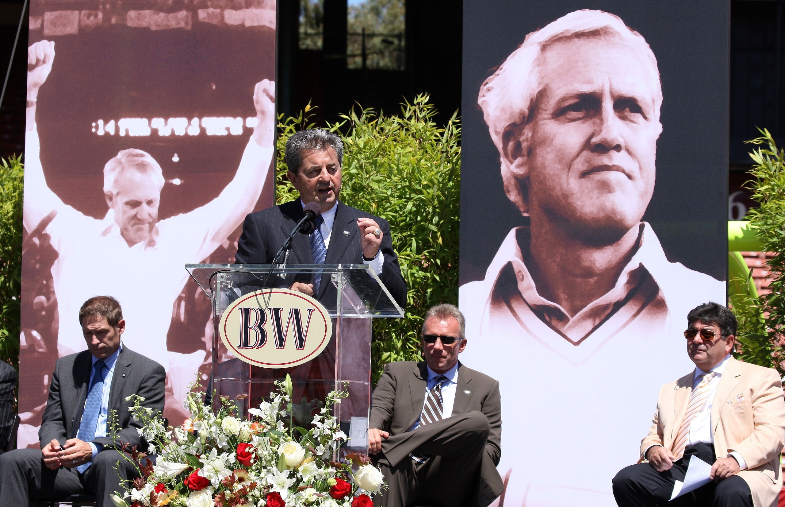 SAN FRANCISCO - AUGUST 10: Former San Francisco 49ers executive Carmen Policy speaks during a public memorial service for former 49ers coach Bill Walsh as Steve Young (L), Joe Montana (C) and Eddie DeBartolo look on August 10, 2007 at Monster Park in San SAN FRANCISCO - AUGUST 10: Former San Francisco 49ers executive Carmen Policy speaks during a public memorial service for former 49ers coach Bill Walsh as Steve Young (L), Joe Montana (C) and Eddie DeBartolo look on August 10, 2007 at Monster Park in San