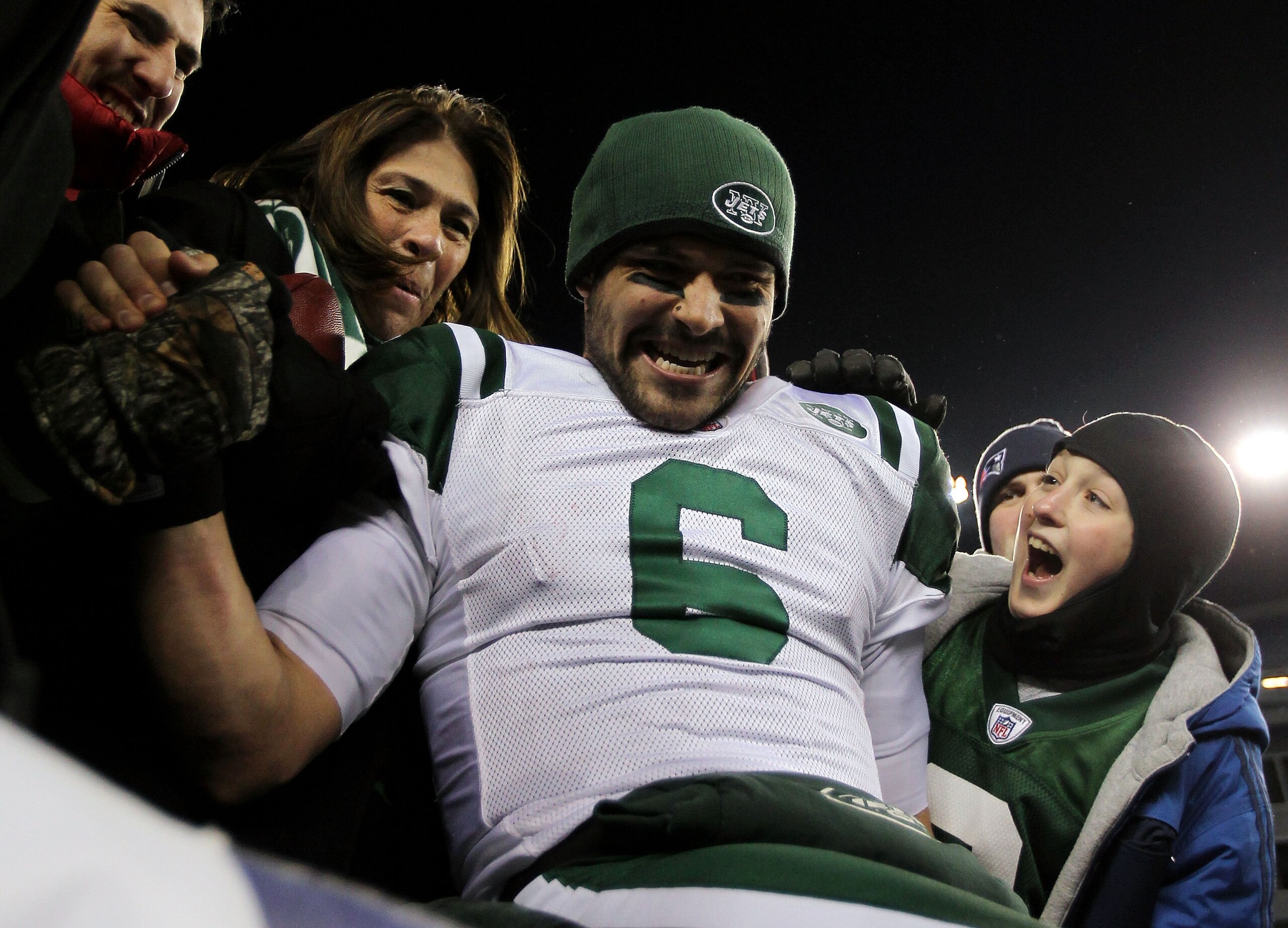 FOXBORO, MA - JANUARY 16:  Mark Sanchez #6 of the New York Jets celebrates with his mother Olga Macias after the Jets defeated the Patriots 28 to 21 in their 2011 AFC divisional playoff game at Gillette Stadium on January 16, 2011 in Foxboro, Massachusett