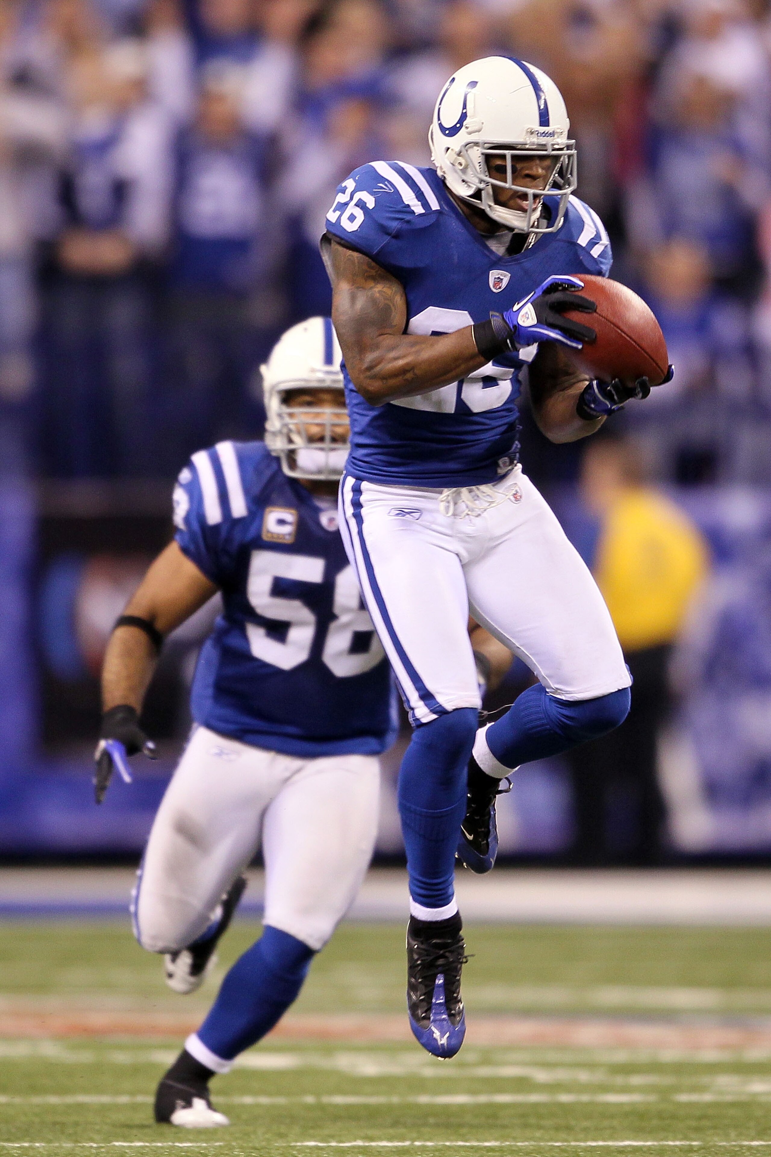 INDIANAPOLIS - JANUARY 24:  Kelvin Hayden #26 of the Indianapolis Colts intercepts a pass thrown by quarterback Mark Sanchez #6 of the New York Jets in the fourth quarter during the AFC Championship Game at Lucas Oil Stadium on January 24, 2010 in Indiana