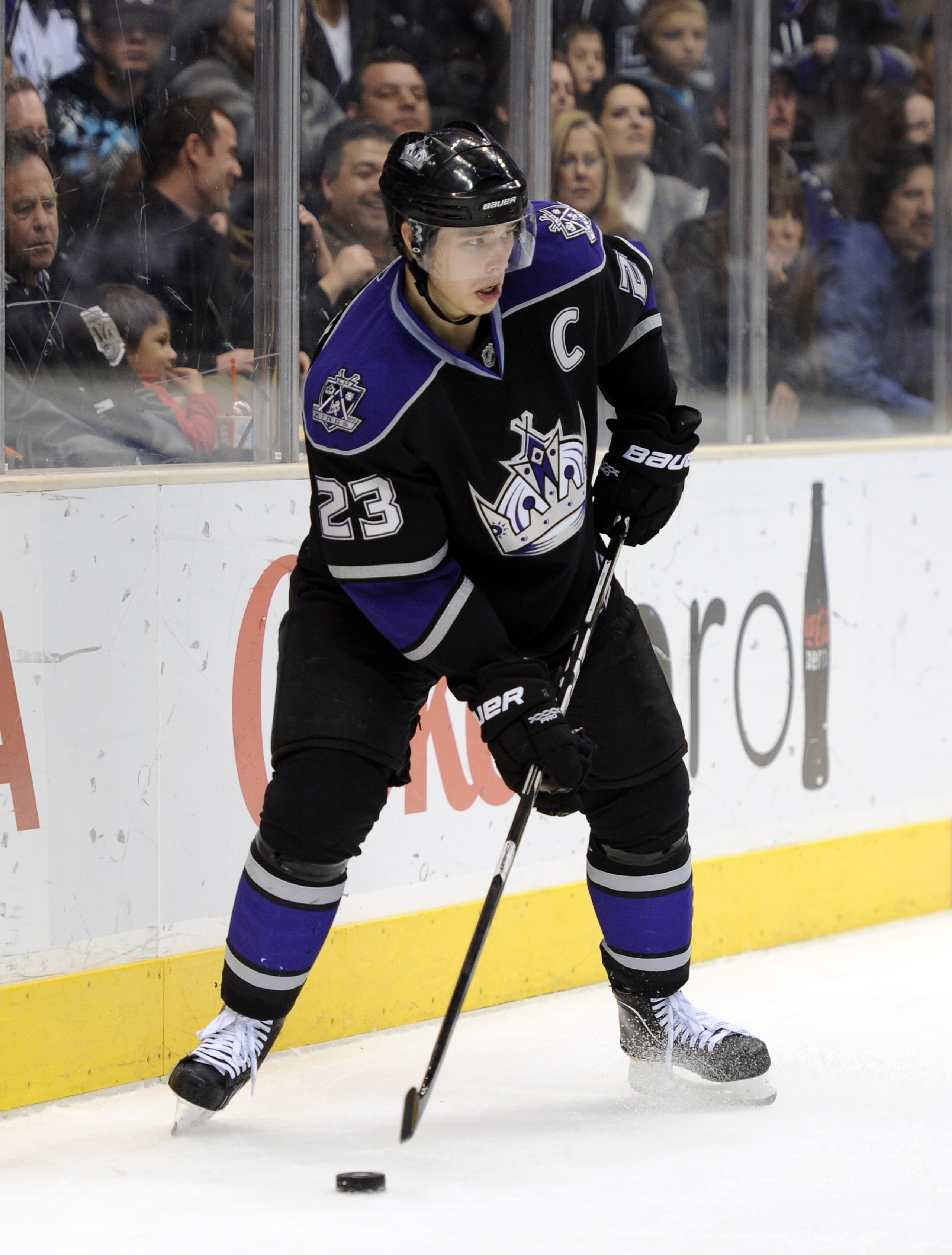 LOS ANGELES, CA - DECEMBER 11:  Dustin Brown #23 of the Los Angeles Kings looks to center the puck against the Minnesota Wild during the game at the Staples Center on December 11, 2010 in Los Angeles, California.  (Photo by Harry How/Getty Images)