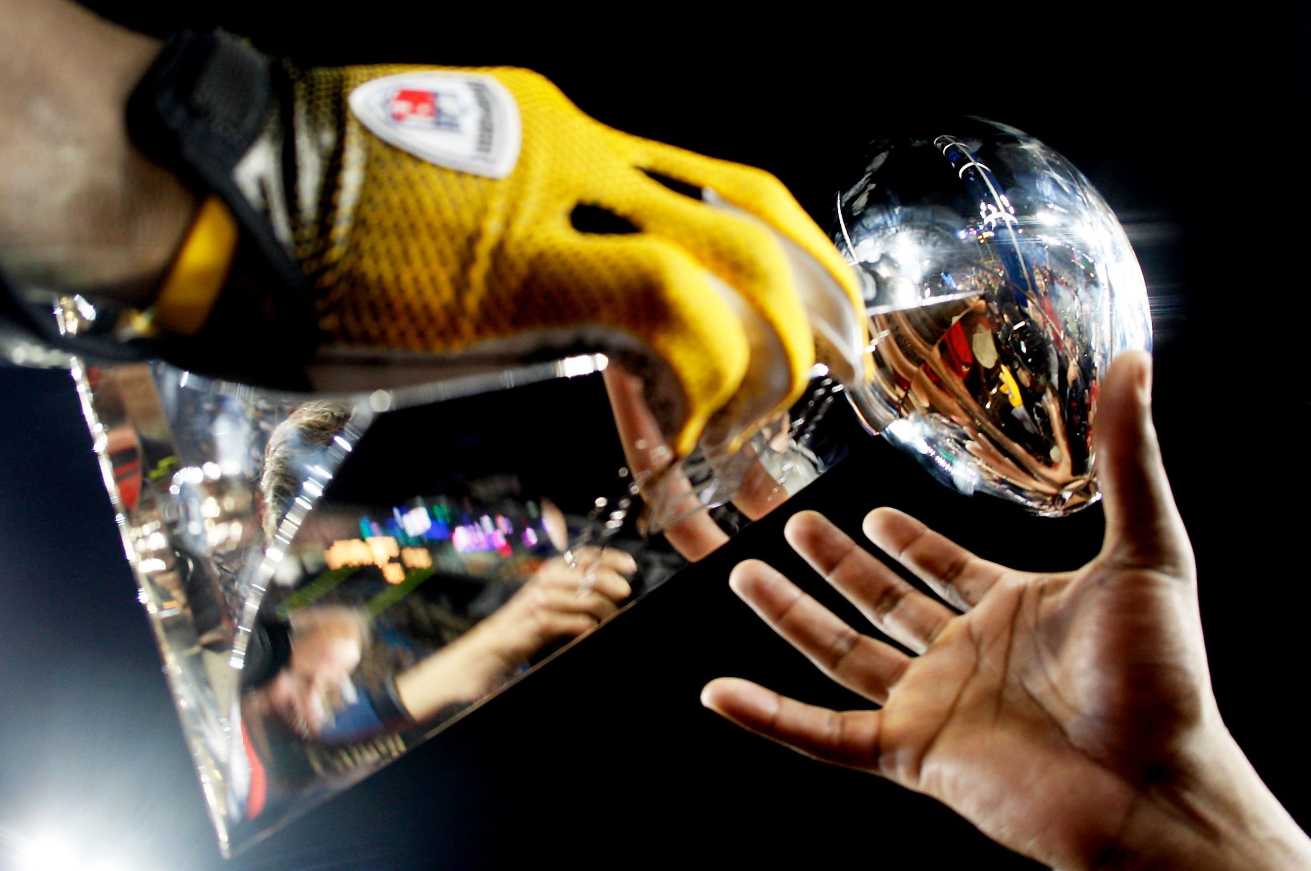 TAMPA, FL - FEBRUARY 01: Players from the Pittsburgh Steelers celebrate with the Vince Lombardi trophy after their 27-23 win against the Arizona Cardinals during Super Bowl XLIII on February 1, 2009 at Raymond James Stadium in Tampa, Florida. (Photo by TAMPA, FL - FEBRUARY 01: Players from the Pittsburgh Steelers celebrate with the Vince Lombardi trophy after their 27-23 win against the Arizona Cardinals during Super Bowl XLIII on February 1, 2009 at Raymond James Stadium in Tampa, Florida. (Photo by