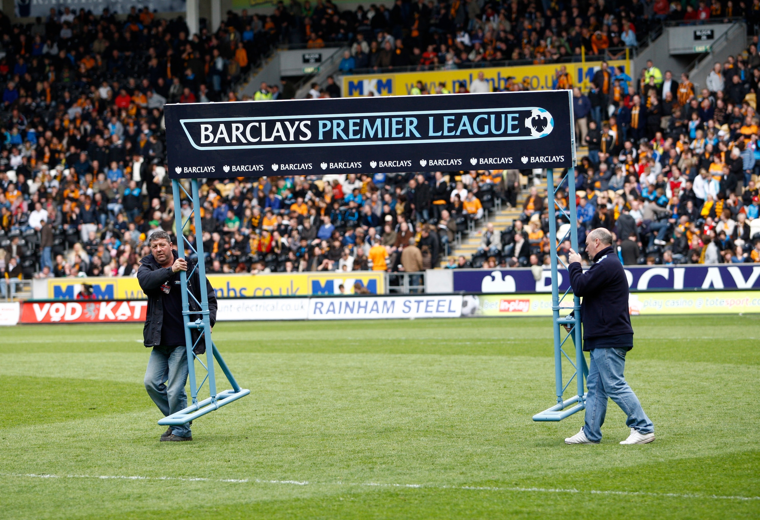 HULL, ENGLAND - MAY 9: The Barclay Premier League sign is removed from the pitch just before the start of the final premier league game at relegated Hull City's KC stadium during the Barclays Premier League match between Hull City and Liverpool at the KC HULL, ENGLAND - MAY 9: The Barclay Premier League sign is removed from the pitch just before the start of the final premier league game at relegated Hull City's KC stadium during the Barclays Premier League match between Hull City and Liverpool at the KC