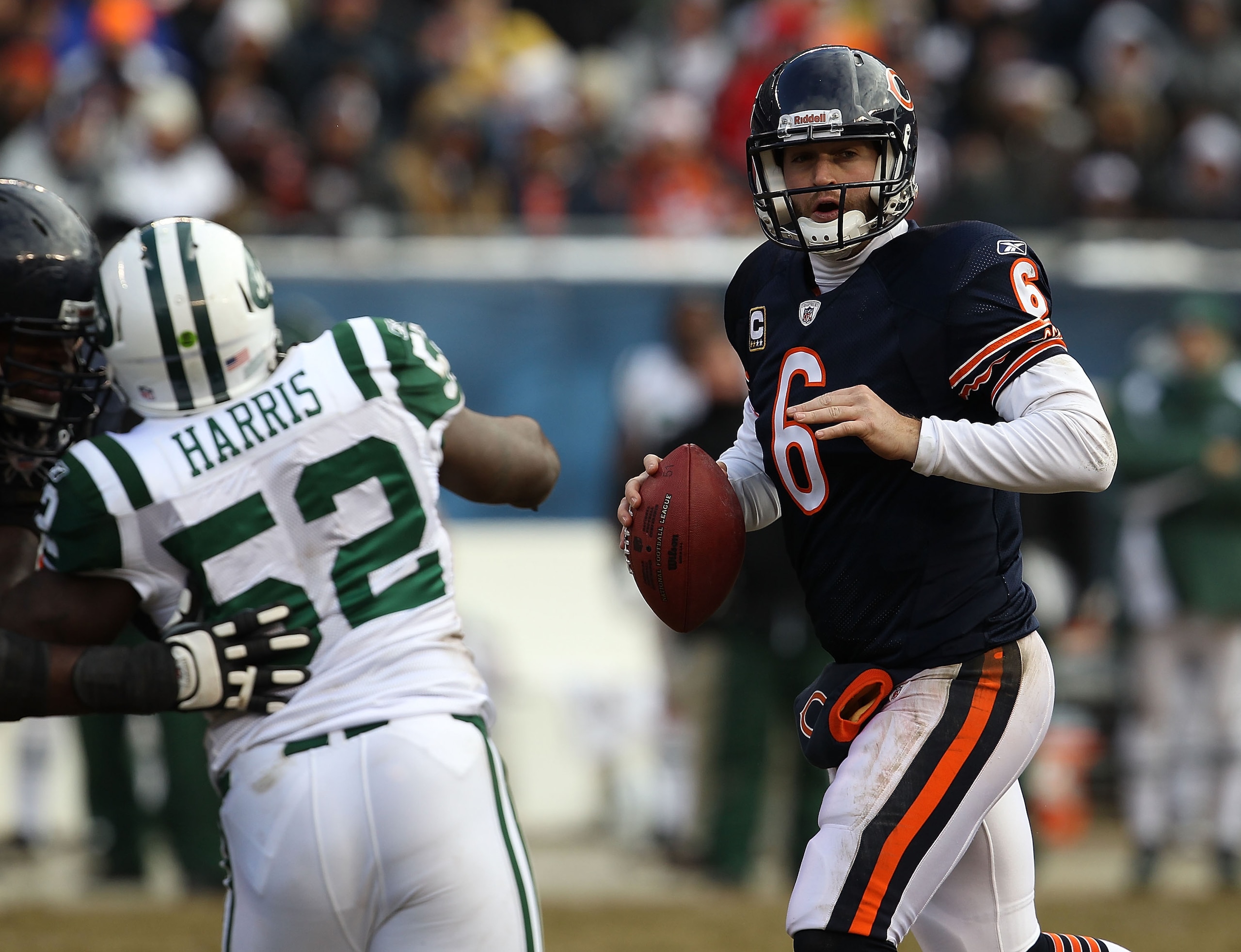 CHICAGO, IL - DECEMBER 26: Jay Cutler #6 of the Chicago Bears looks for a receiver as David Harris #52 of the New York Jets rushes at Soldier Field on December 26, 2010 in Chicago, Illinois. The Bears defeated the Jets 38-34. (Photo by Jonathan Daniel/Get