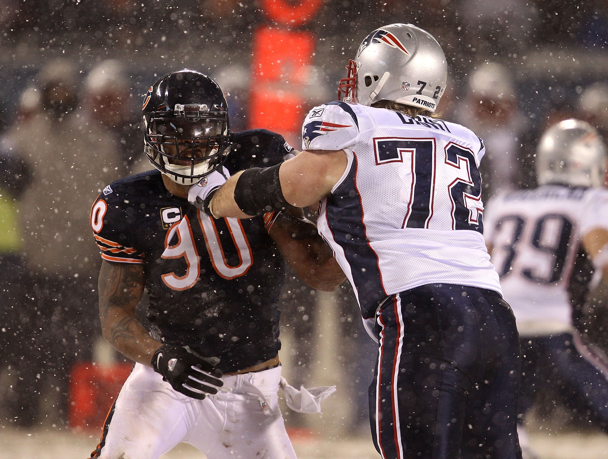 CHICAGO, IL - DECEMBER 12: Julius Peppers #90 of the Chicago Bears rushes against Matt Light #72 of the New England Patriots at Soldier Field on December 12, 2010 in Chicago, Illinois. The Patriots defeated the Bears 36-7. (Photo by Jonathan Daniel/Getty