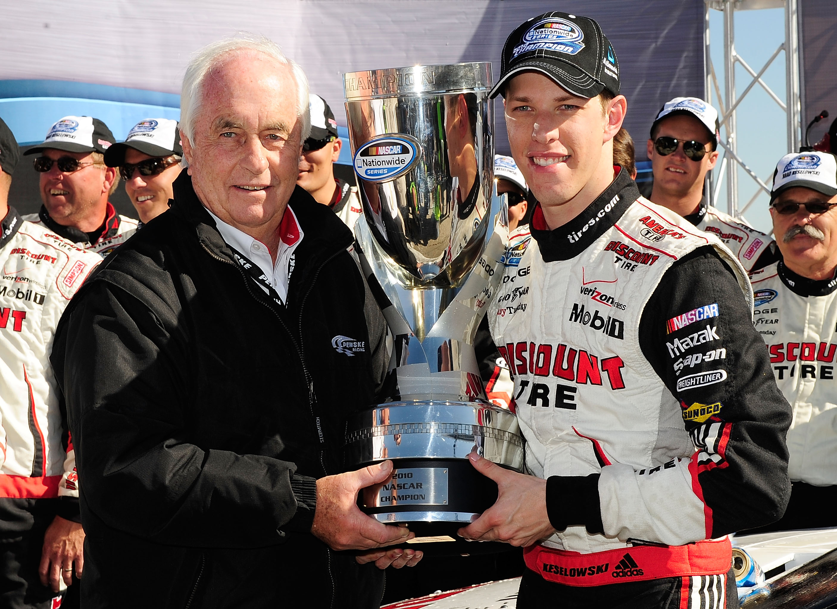 FORT WORTH, TX - NOVEMBER 06:  Brad Keselowski, driver of the #22 Discount Tire Dodge, celebrates with Team Owner Roger Penske on pit road after winning the Nationwide Championship with a third-place finish in the NASCAR Nationwide Series O'Reilly Auto Pa
