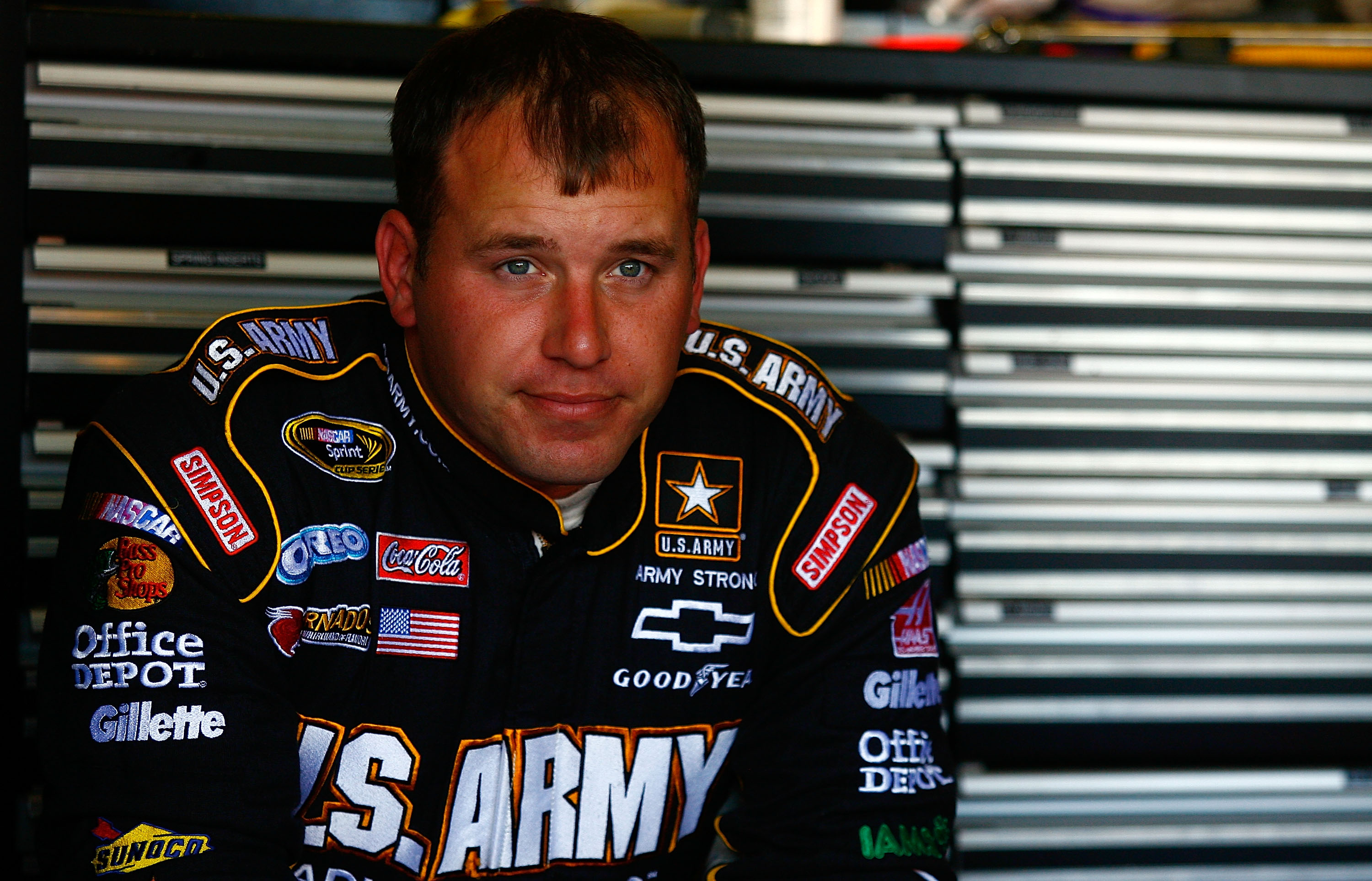 AVONDALE, AZ - NOVEMBER 13:  Ryan Newman, driver of the #39 U.S. ARMY Chevrolet sits in the garage area during practice for the NASCAR Sprint Cup Series Kobalt Tools 500 at Phoenix International Raceway on November 13, 2010 in Avondale, Arizona.  (Photo b