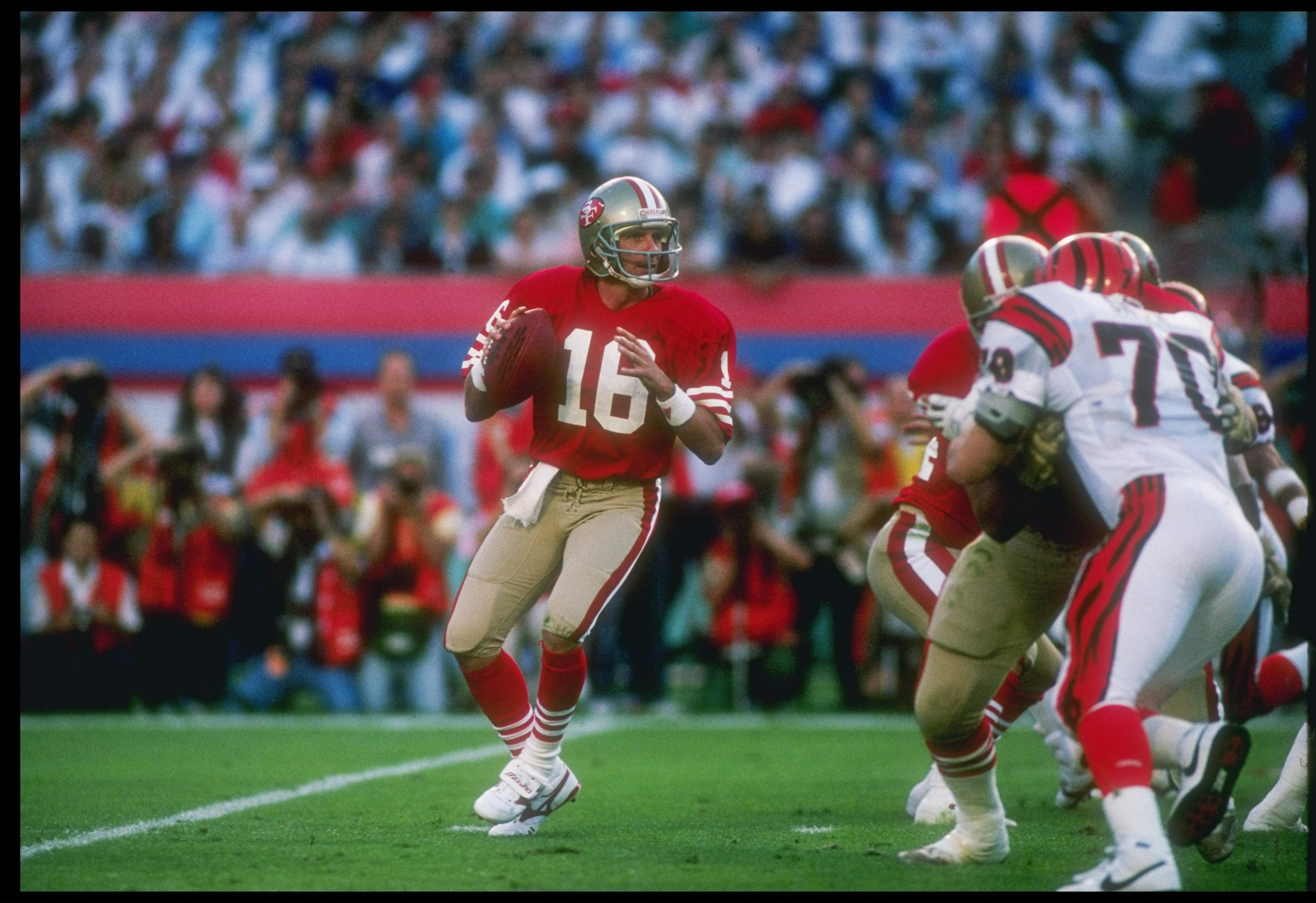 22 Jan 1989:  Quarterback Joe Montana #16 of the San Francisco 49ers is looking to pass during the Super Bowl XXIII game against the Cincinnati Bengals at the Joe Robbie Stadium in Miami, Florida.  The 49ers won, 20-16. Mandatory Credit: Mike Powell  /All