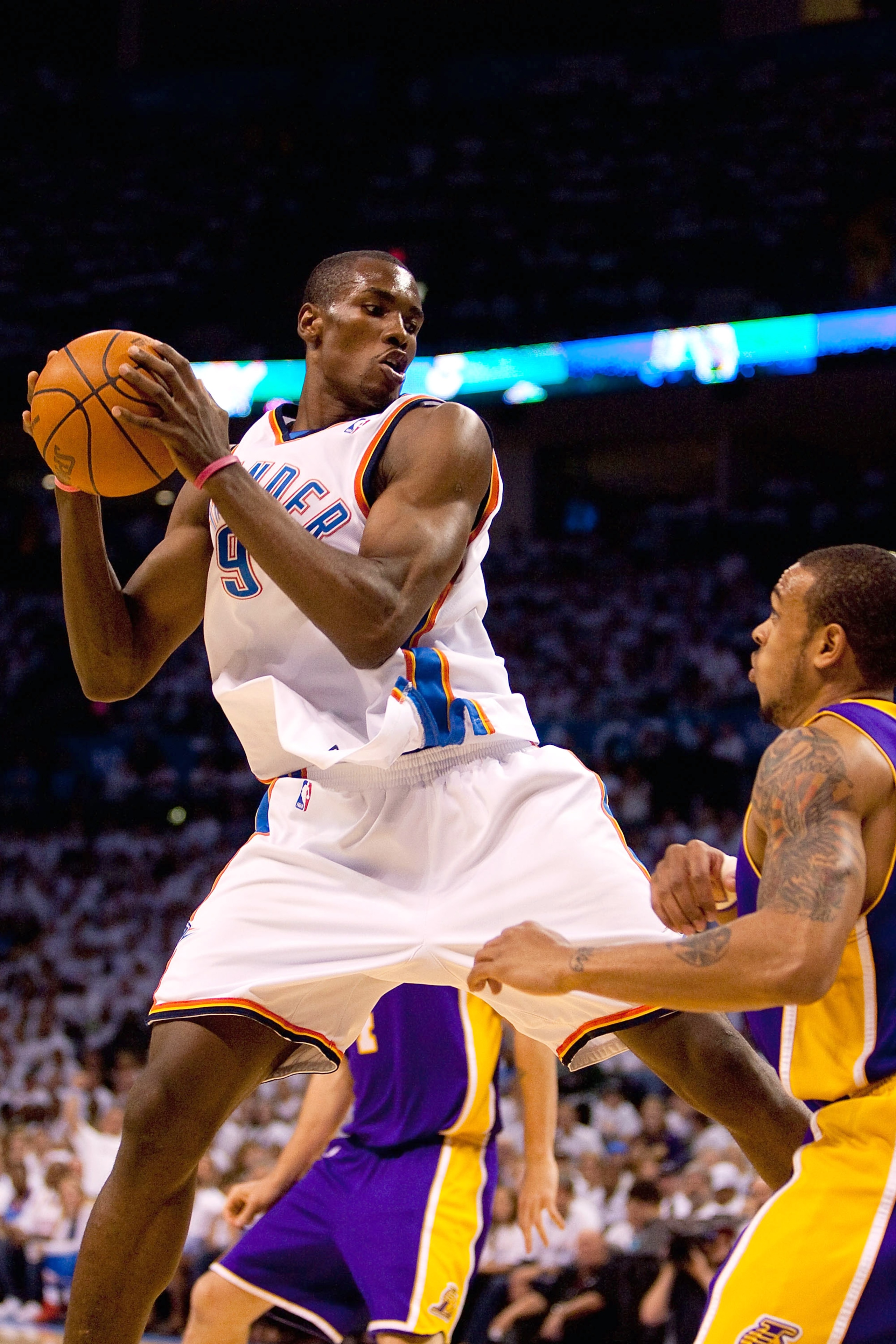 OKLAHOMA CITY - APRIL 24: Serge Ibaka #9 of the Oklahoma City Thunder pulls down a rebound against the Los Angeles Lakers during Game Four of the Western Conference Quarterfinals of the 2010 NBA Playoffs on April 24, 2010 at the Ford Center in Oklahoma Ci