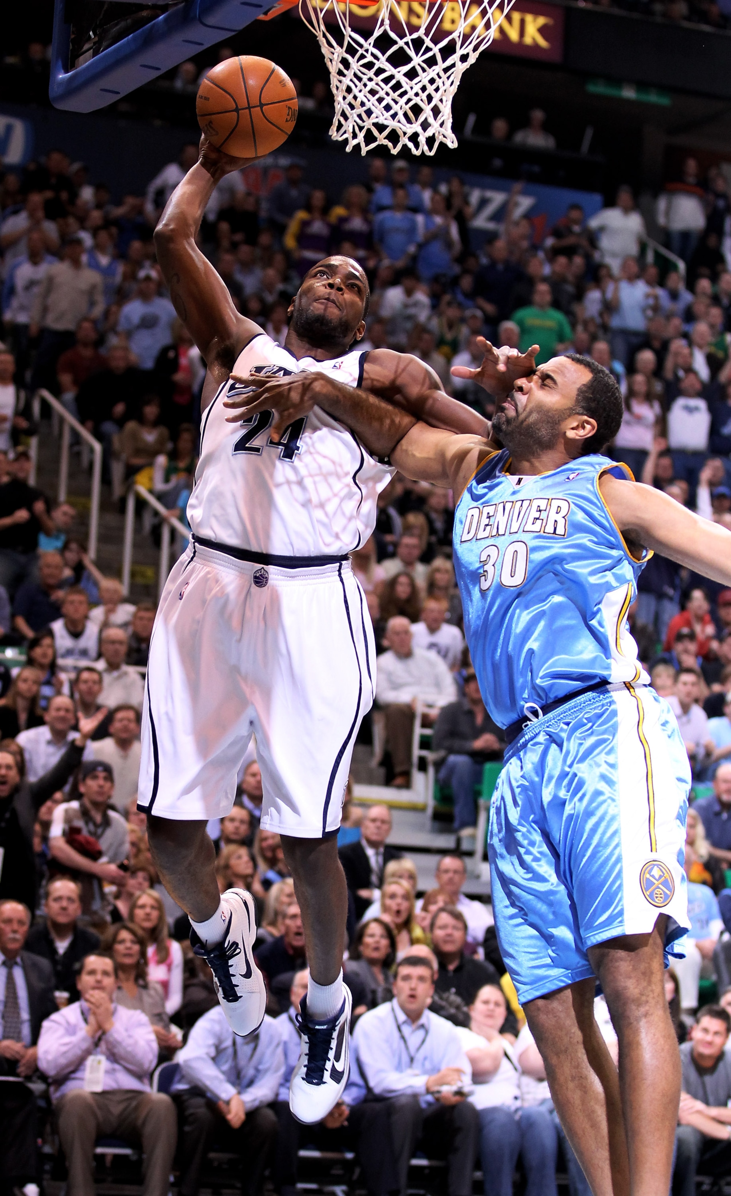 SALT LAKE CITY - APRIL 30:  Paul Millsap #24 of the Utah Jazz dunks over Malik Allen #30 of the Denver Nuggets during Game Six of the Western Conference Quarterfinals of the 2010 NBA Playoffs at EnergySolutions Arena on April 30, 2010 in Salt Lake City, U