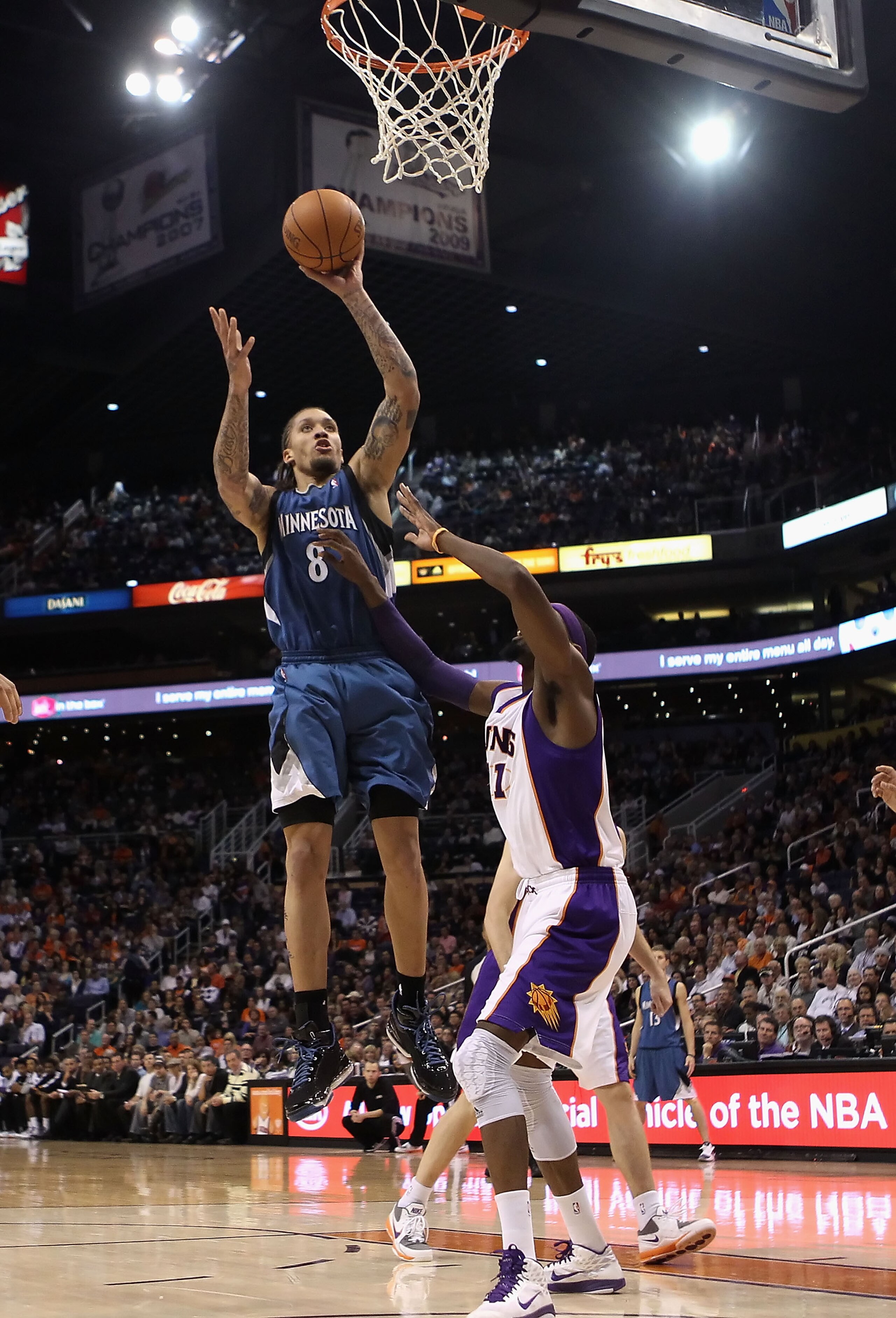 PHOENIX - DECEMBER 15:  Michael Beasley #8 of the Minnesota Timberwolves puts up a shot against the Phoenix Suns during the NBA game at US Airways Center on December 15, 2010 in Phoenix, Arizona. NOTE TO USER: User expressly acknowledges and agrees that,