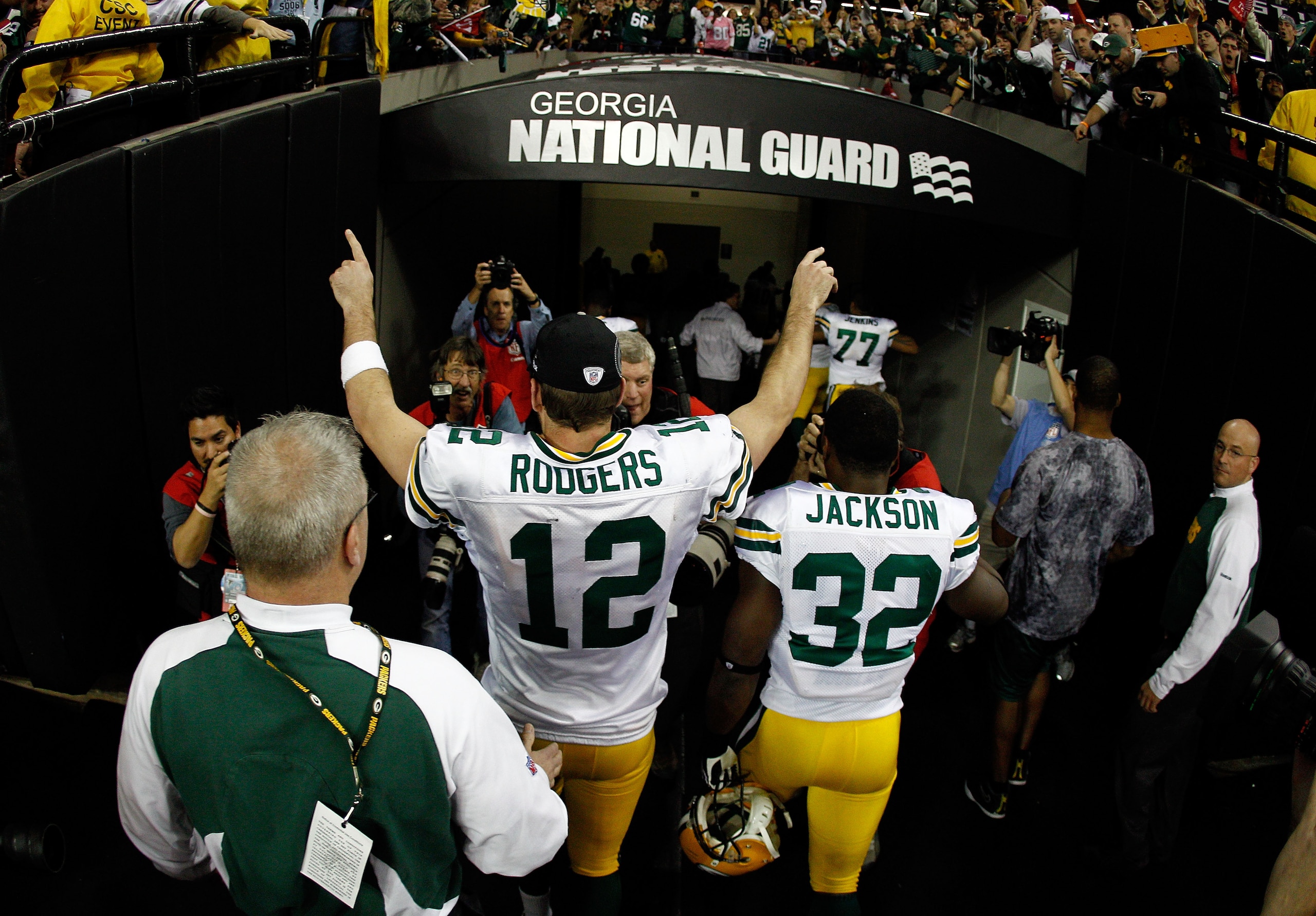 ATLANTA, GA - JANUARY 15:  Aaron Rodgers #12 and Brandon Jackson #32 of the Green Bay Packers celebrate as they walk off the field after the Packers won 48-21 against the Atlanta Falcons during their 2011 NFC divisional playoff game at Georgia Dome on Jan