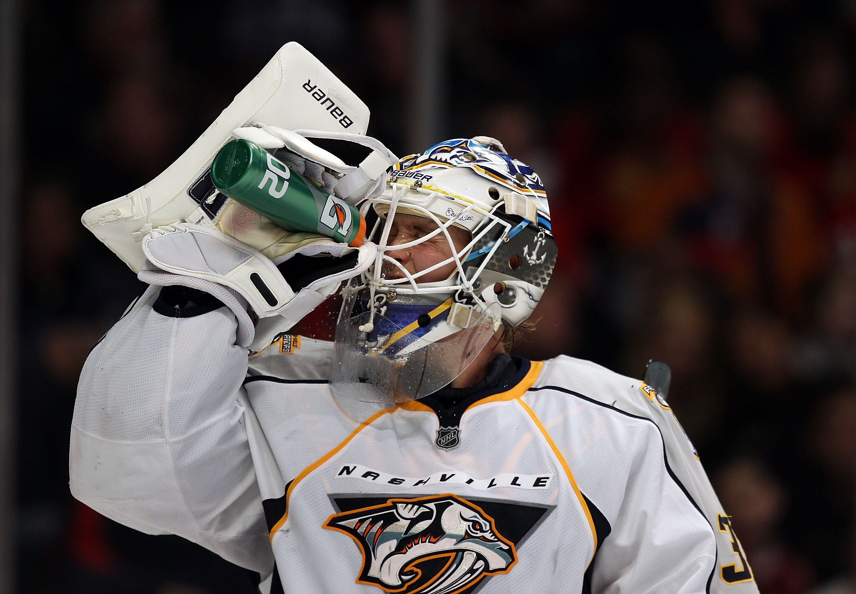 CHICAGO, IL - DECEMBER 22: Anders Lindback #39 of the Nashville Predators sprays water on his face during a break in the action against the Chicago Blackhawks at the United Center on December 22, 2010 in Chicago, Illinois. The Blackhawks defeated the Pred