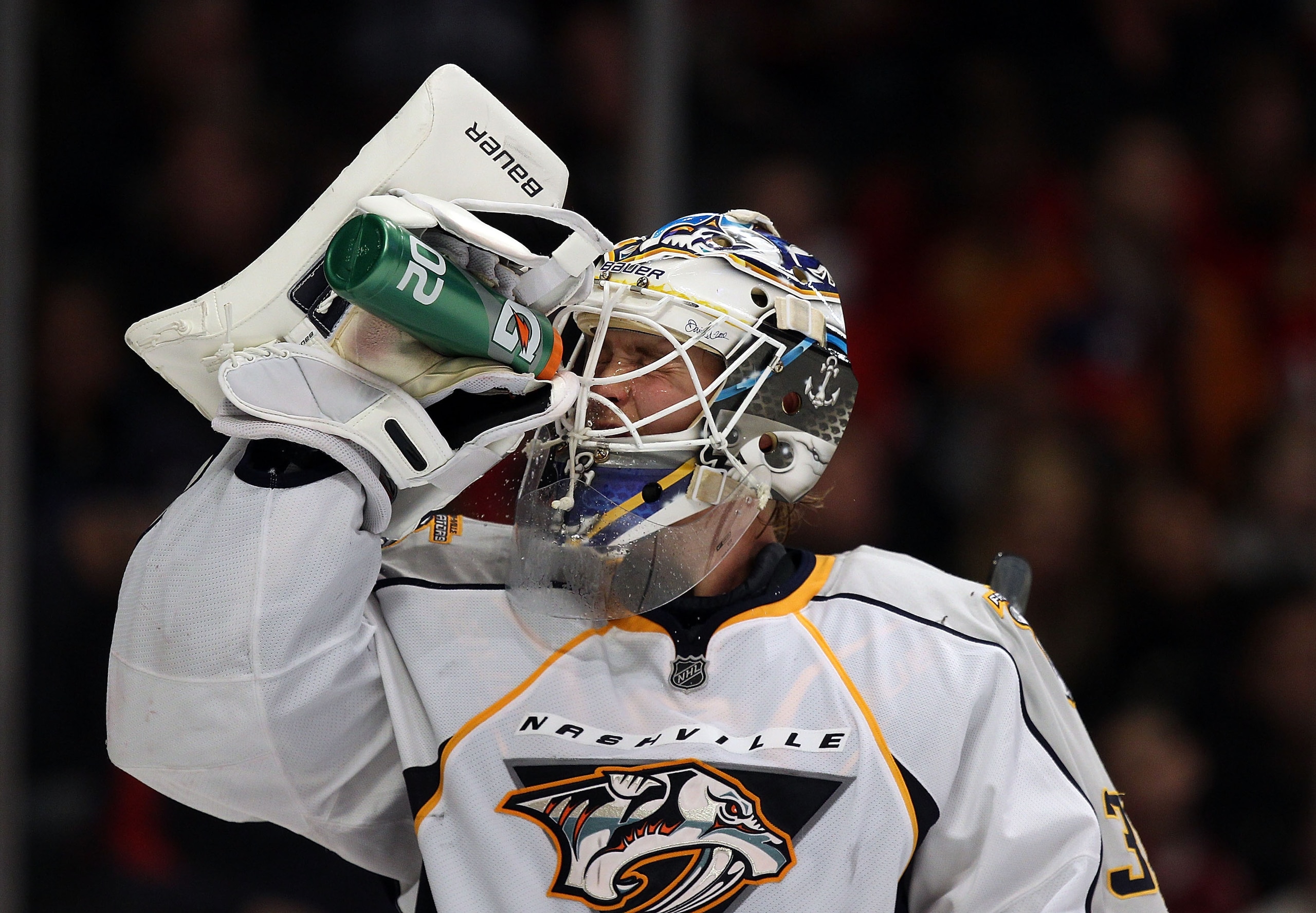 CHICAGO, IL - DECEMBER 22: Anders Lindback #39 of the Nashville Predators sprays water on his face during a break in the action against the Chicago Blackhawks at the United Center on December 22, 2010 in Chicago, Illinois. The Blackhawks defeated the Pred