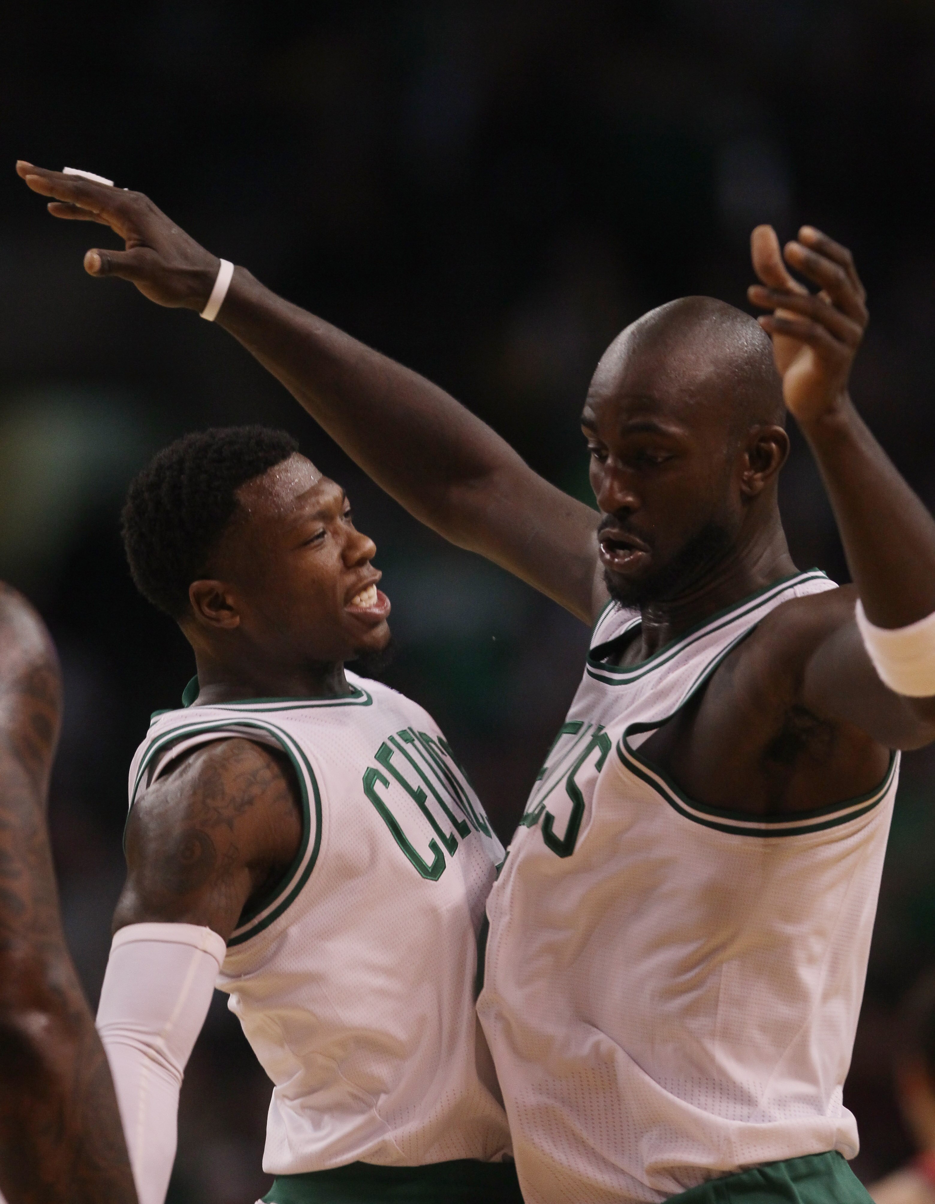 BOSTON - NOVEMBER 24:  Nate Robinson #4 and Kevin Garnett #5 of the Boston Celtics celebrate Garnett's shot in the fourth quarter against the New Jersey Nets on November 24, 2010 at the TD Garden in Boston, Massachusetts. The Celtics defeated the nets 89-