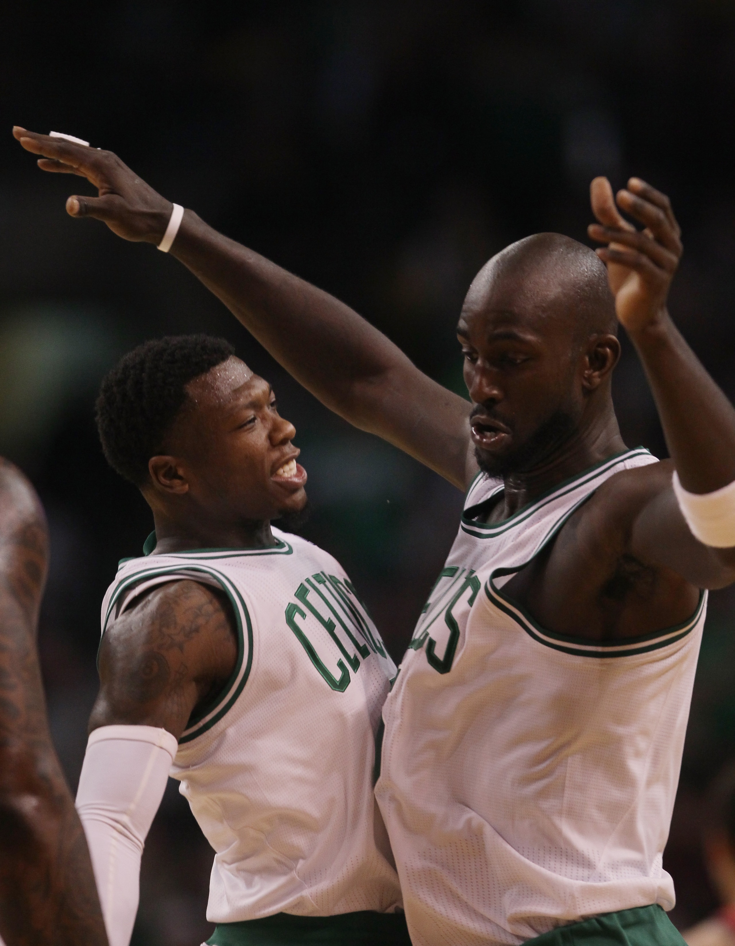 BOSTON - NOVEMBER 24:  Nate Robinson #4 and Kevin Garnett #5 of the Boston Celtics celebrate Garnett's shot in the fourth quarter against the New Jersey Nets on November 24, 2010 at the TD Garden in Boston, Massachusetts. The Celtics defeated the nets 89-