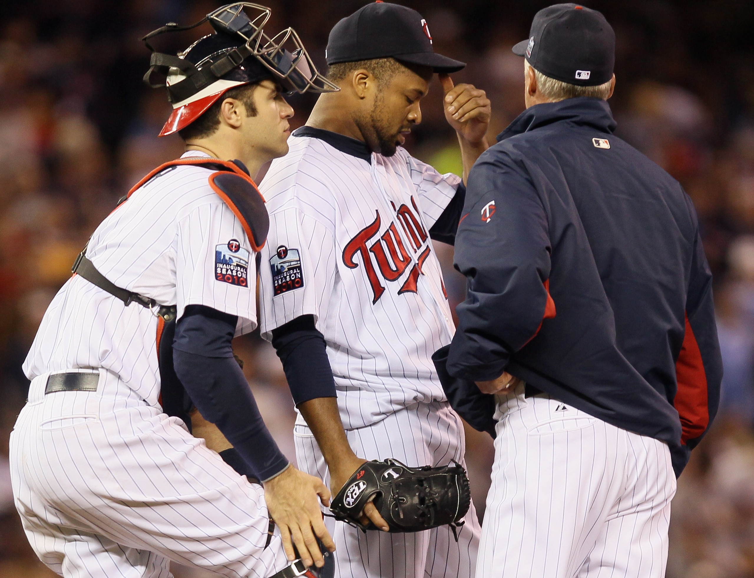 MINNEAPOLIS - OCTOBER 06: Starting pitcher Francisco Liriano #47 of the Minnesota Twins talks with Joe Mauer #7 and pitching coach Rick Anderson in the sixth inning against the New York Yankees during game one of the ALDS on October 6, 2010 at Target Fie MINNEAPOLIS - OCTOBER 06: Starting pitcher Francisco Liriano #47 of the Minnesota Twins talks with Joe Mauer #7 and pitching coach Rick Anderson in the sixth inning against the New York Yankees during game one of the ALDS on October 6, 2010 at Target Fie