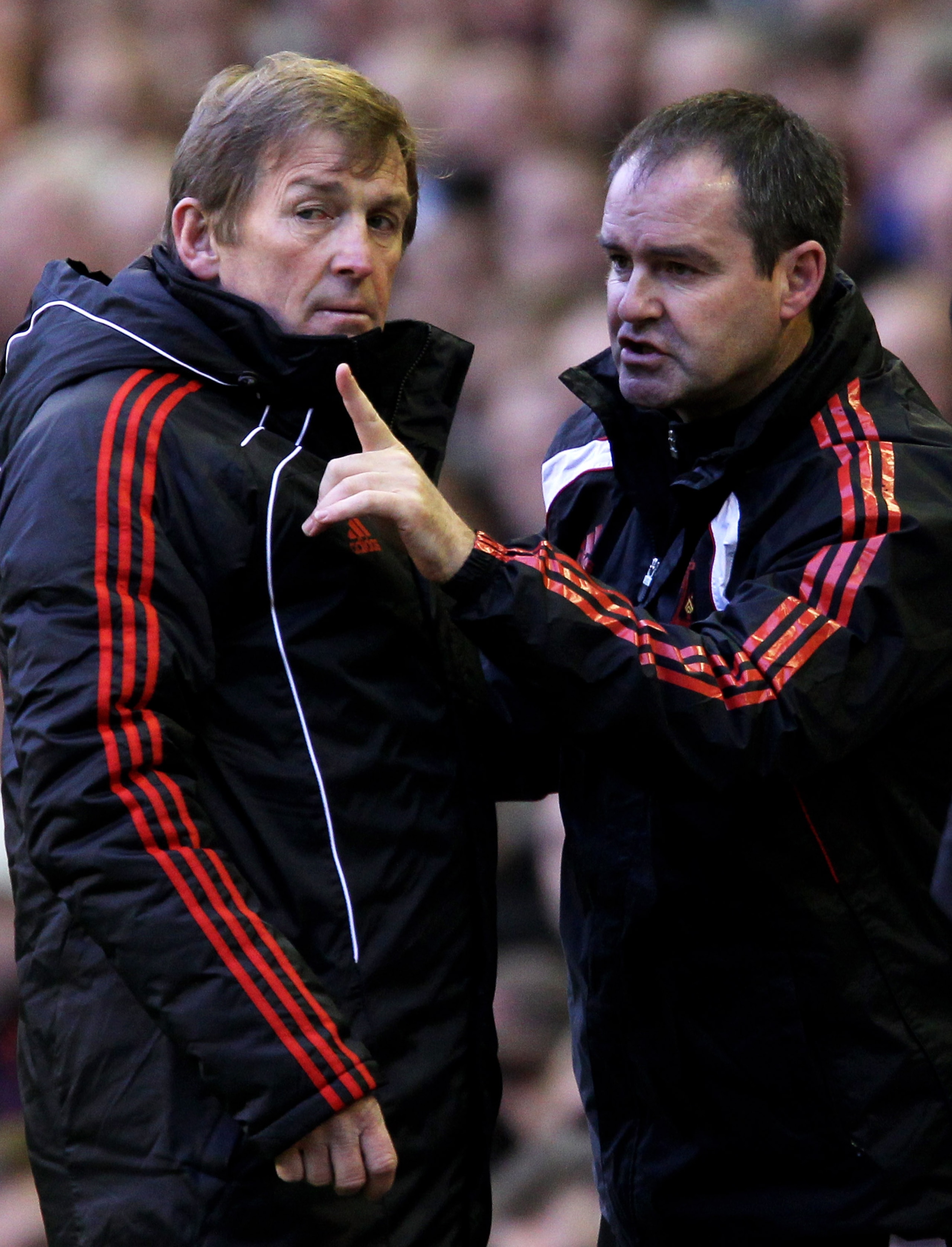 LIVERPOOL, ENGLAND - JANUARY 16:  Liverpool Manager Kenny Dalglish issues instructions with Head Coach Steve Clarke (R) prior to the Barclays Premier League match between Liverpool and Everton at Anfield on January 16, 2011 in Liverpool, England.  (Photo