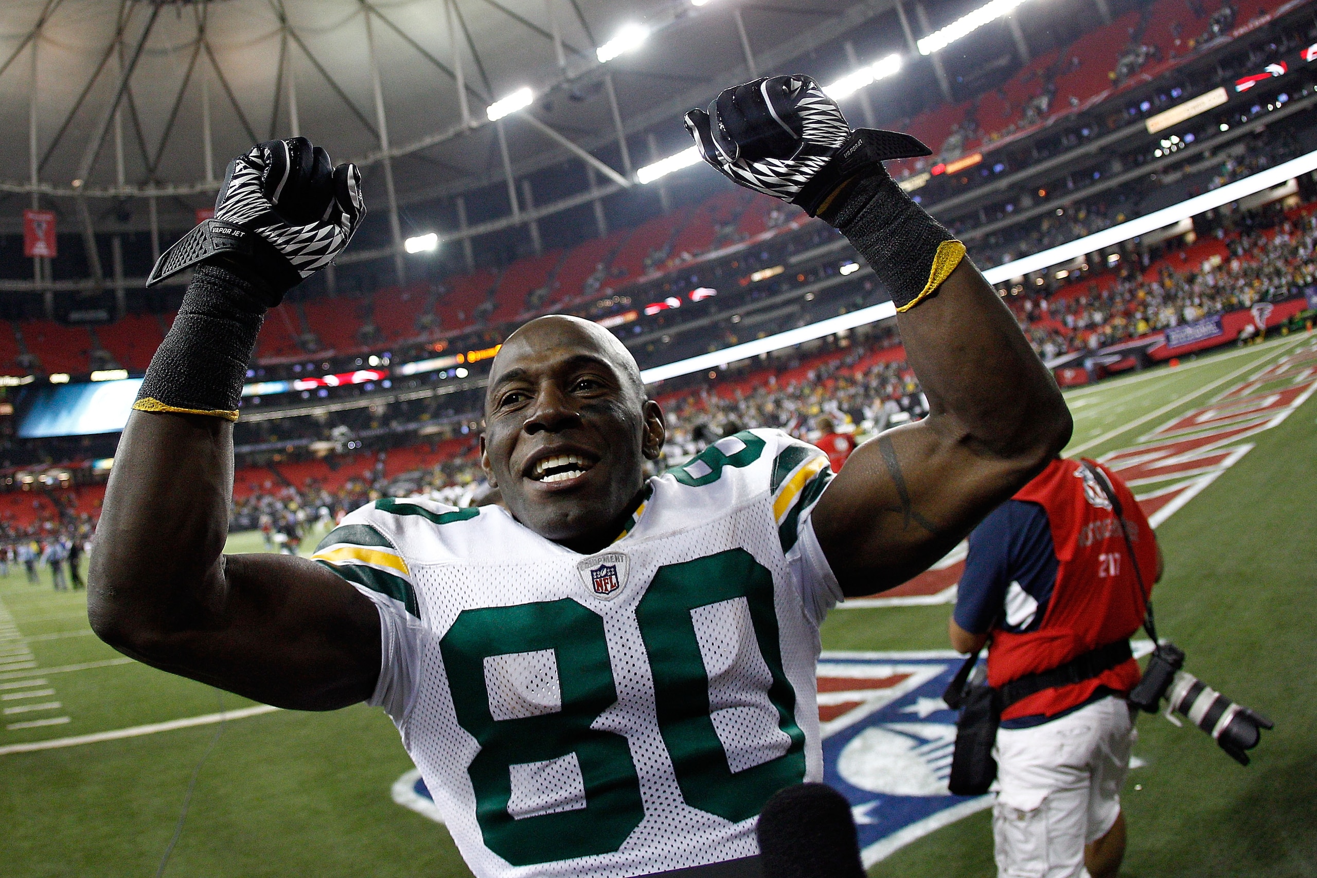 ATLANTA, GA - JANUARY 15:  Donald Driver #80 of the Green Bay Packers celebrates as he walks off the field after the Packers own 48-21 against the Atlanta Falcons during their 2011 NFC divisional playoff game at Georgia Dome on January 15, 2011 in Atlanta