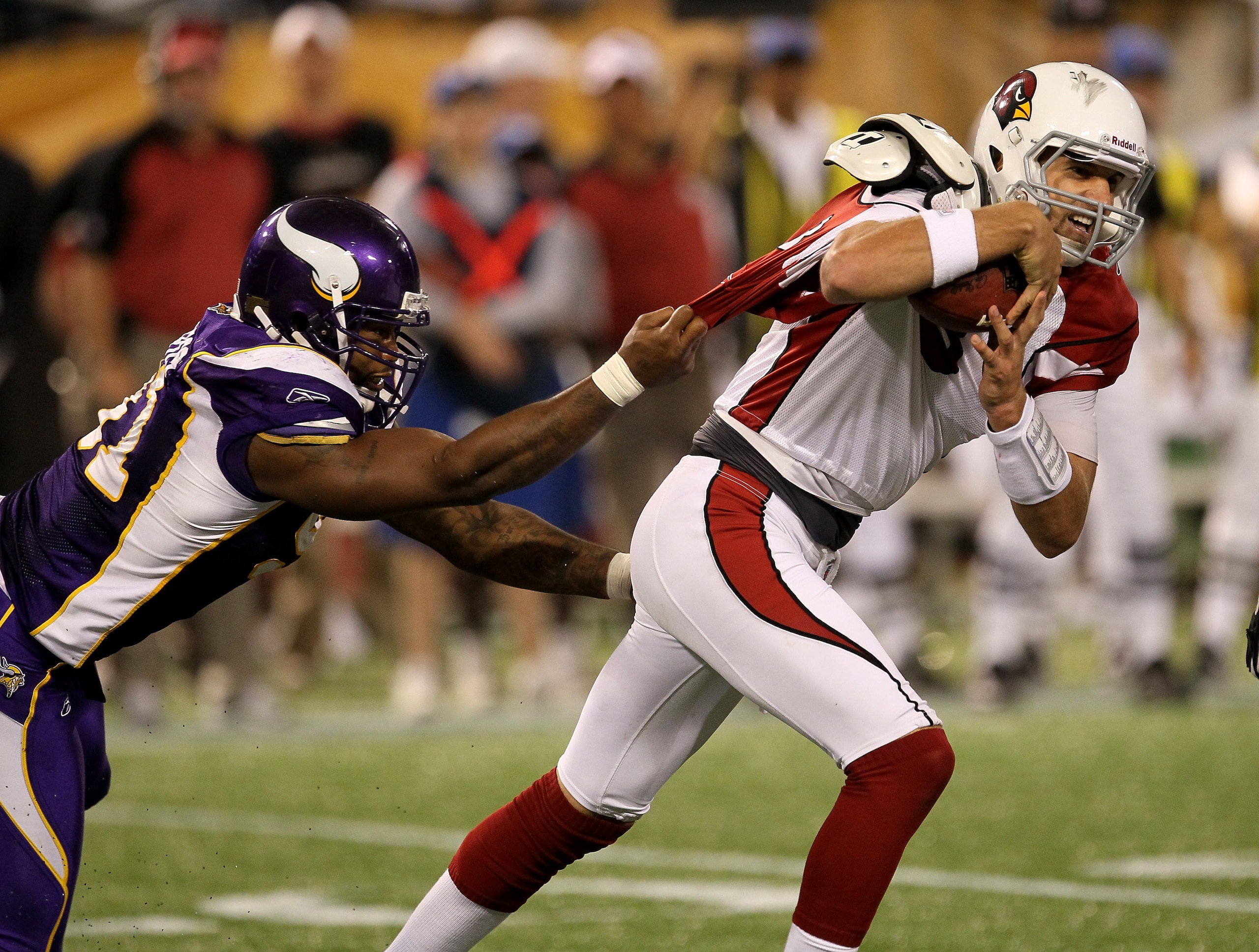 MINNEAPOLIS - NOVEMBER 7: Defensive end Ray Edwards #91 of the Minnesota Vikings grabs the jersey of quarterback Derek Anderson #3 of the Arizona Cardinals at Hubert H. Humphrey Metrodome on November 7, 2010 in Minneapolis, Minnesota.  The Vikings won 27-