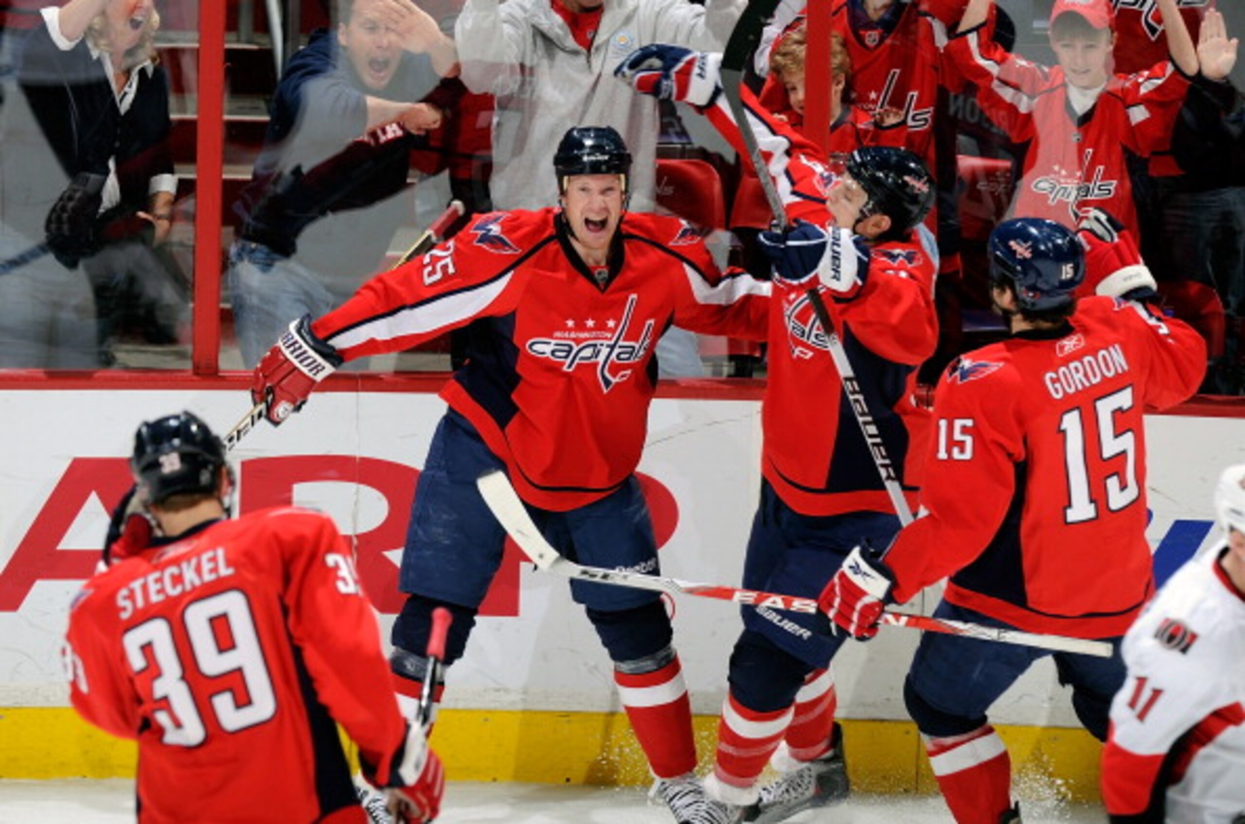 WASHINGTON, DC - JANUARY 16:  Jason Chimera #25 of the Washington Capitals celebrates with John Carlson #74 after scoring in the third period against the Ottawa Senators at the Verizon Center on January 16, 2011 in Washington, DC. The Capitals won the gam