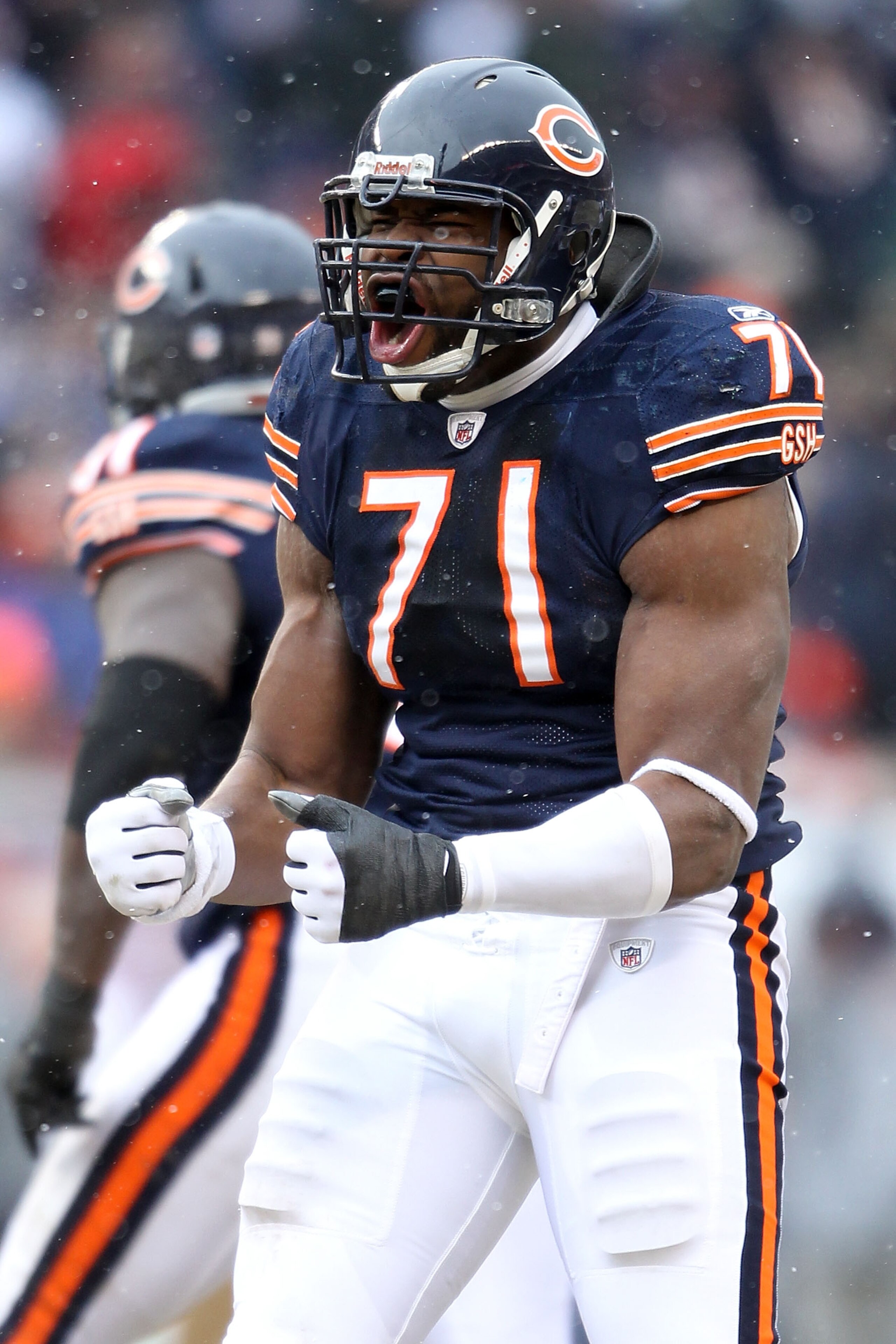CHICAGO, IL - JANUARY 16:  Israel Idonije #71 of the Chicago Bears reacts after a Bears sack on quarterback Matt Hasselbeck #8 of the Seattle Seahawks in the second quarter of the 2011 NFC divisional playoff game at Soldier Field on January 16, 2011 in Ch