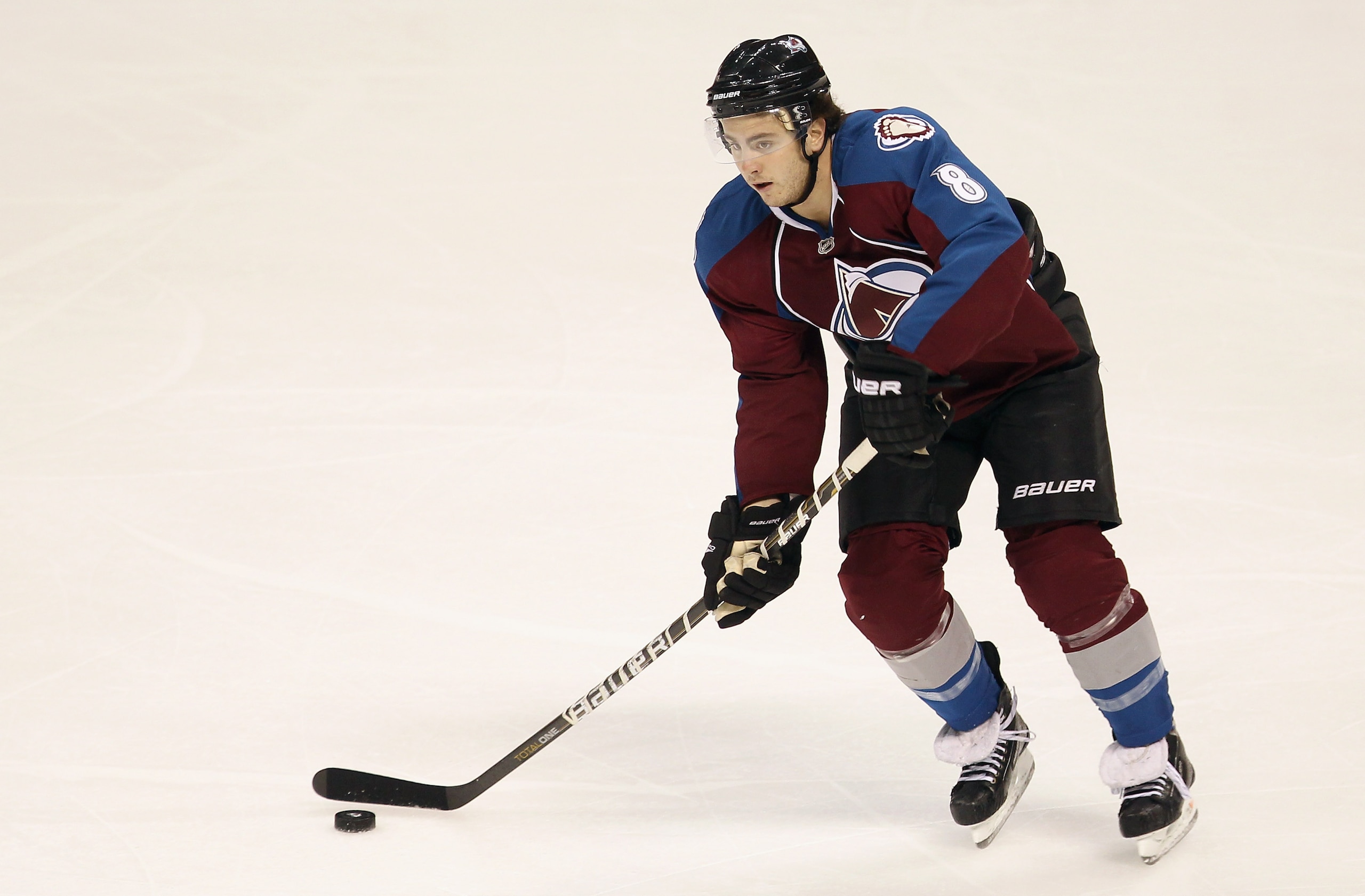 DENVER - DECEMBER 23:  Kevin Shattenkirk #8 of the Colorado Avalanche controls the puck against the Minnesota Wild at the Pepsi Center on December 23, 2010 in Denver, Colorado. The Wild defeated the Avalanche 3-1.  (Photo by Doug Pensinger/Getty Images)