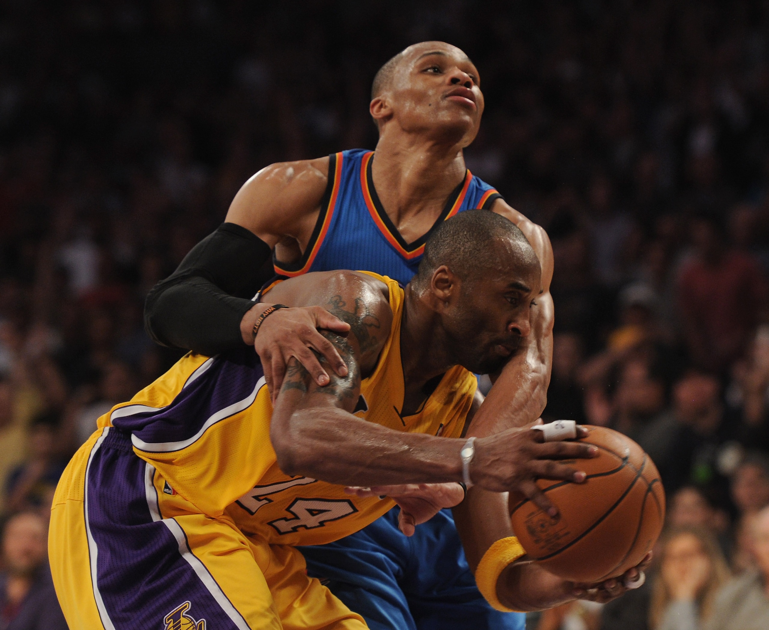 LOS ANGELES, CA - JANUARY 17:  Kobe Bryant #24 of the Los Angeles Lakers is fouled by Russell Westbrook #0 of the Oklahoma City Thunder during a 101-94 Laker win at the Staples Center on January 17, 2011 in Los Angeles, California.   NOTE TO USER: User ex