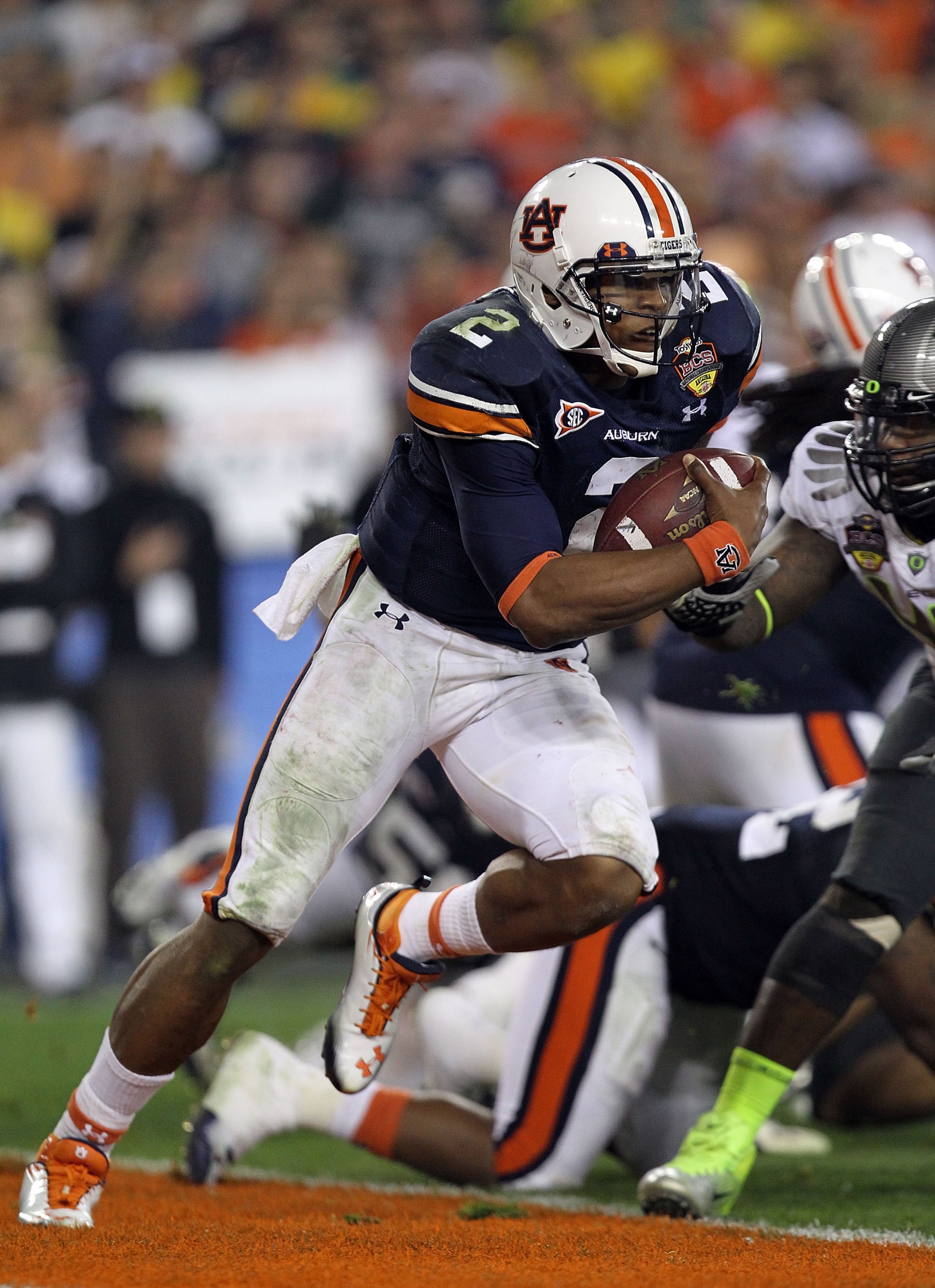 GLENDALE, AZ - JANUARY 10: Quarterback Cameron Newton #2 of the Auburn Tigers runs the ball in the third quarter against the Oregon Ducks during the Tostitos BCS National Championship Game at University of Phoenix Stadium on January 10, 2011 in Glendale, GLENDALE, AZ - JANUARY 10: Quarterback Cameron Newton #2 of the Auburn Tigers runs the ball in the third quarter against the Oregon Ducks during the Tostitos BCS National Championship Game at University of Phoenix Stadium on January 10, 2011 in Glendale,