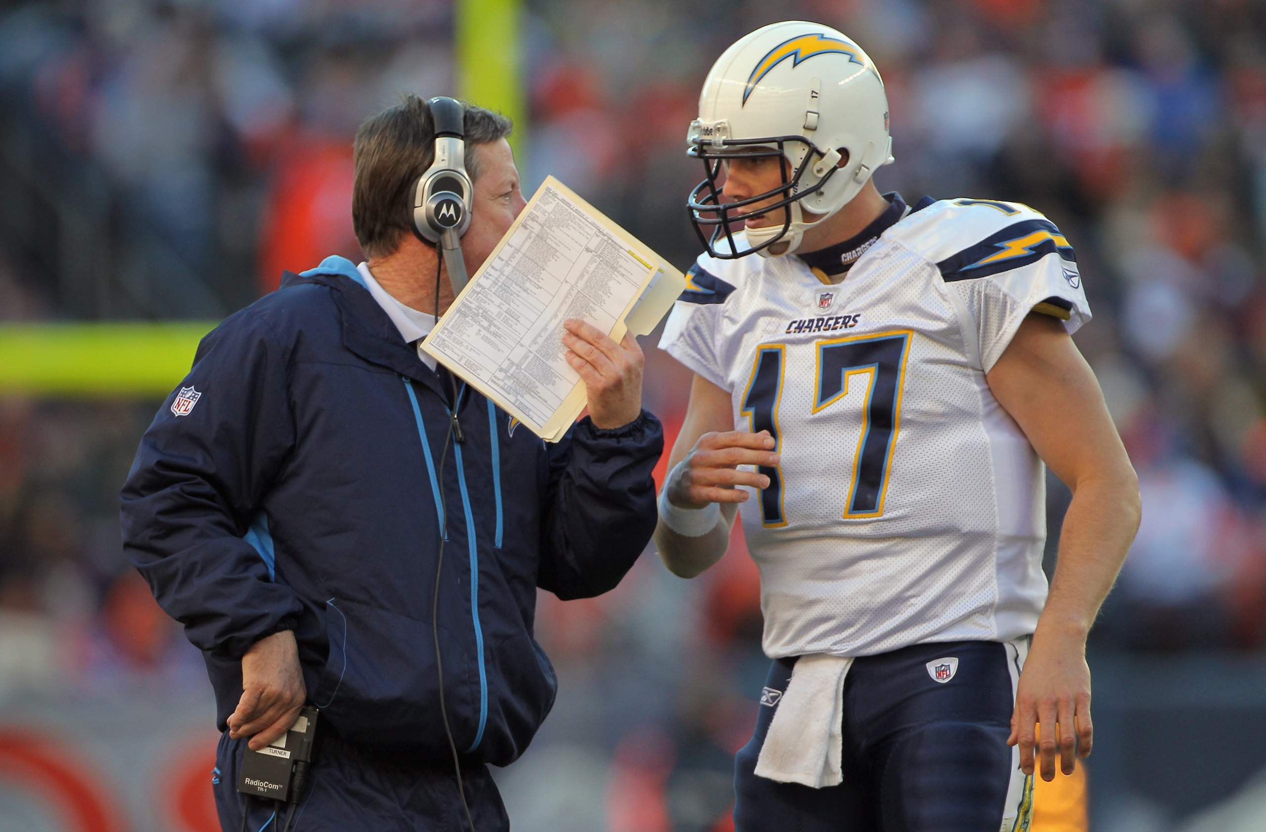 DENVER - JANUARY 02:  Head coach Norv Turner talks with quarterback Philip Rivers #17 of the San Diego Chargers as they face the Denver Broncos at INVESCO Field at Mile High on January 2, 2011 in Denver, Colorado. The Chargers defeated the Broncos 33-28.