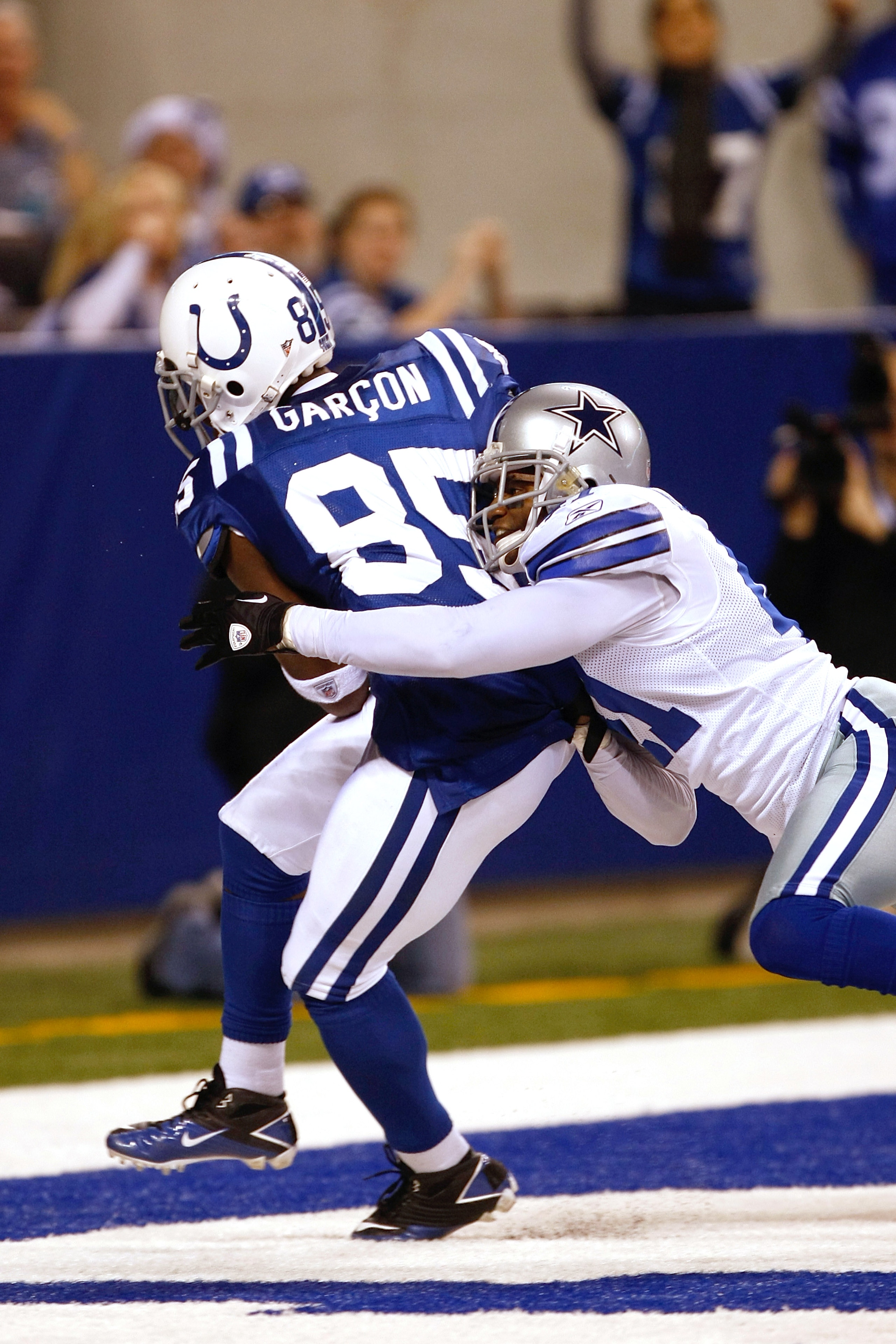 INDIANAPOLIS, IN - DECEMBER 05: Pierre Garcon #85 of the Indianapolis Colts scores a touchdown as Terrence Newman #41 of the Dallas Cowboys defends at Lucas Oil Stadium on December 5, 2010 in Indianapolis, Indiana. (Photo by Scott Boehm/Getty Images) INDIANAPOLIS, IN - DECEMBER 05: Pierre Garcon #85 of the Indianapolis Colts scores a touchdown as Terrence Newman #41 of the Dallas Cowboys defends at Lucas Oil Stadium on December 5, 2010 in Indianapolis, Indiana. (Photo by Scott Boehm/Getty Images)