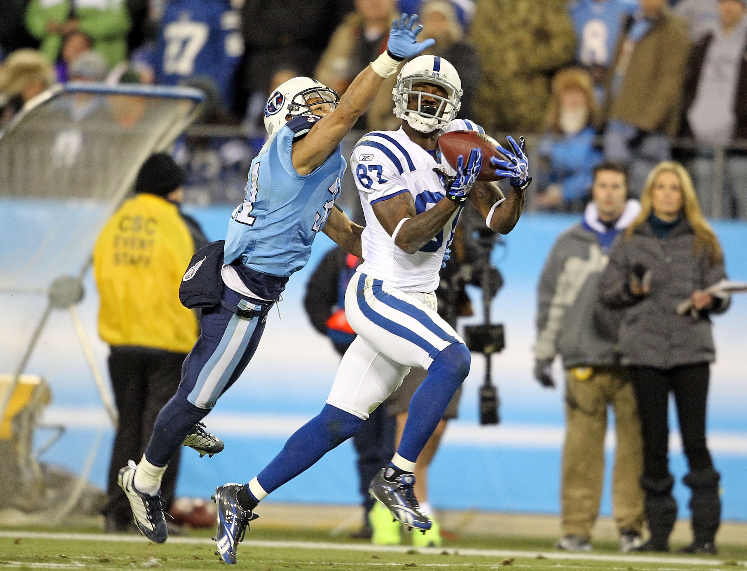 NASHVILLE, TN - DECEMBER 09: Reggie Wayne #87 of the Indianapolis Colts catches a pass while defended by Cortland Finnegan #31 of the Tennessee Titans during the NFL game at LP Field on December 9, 2010 in Nashville, Tennessee. (Photo by Andy Lyons/Get NASHVILLE, TN - DECEMBER 09: Reggie Wayne #87 of the Indianapolis Colts catches a pass while defended by Cortland Finnegan #31 of the Tennessee Titans during the NFL game at LP Field on December 9, 2010 in Nashville, Tennessee. (Photo by Andy Lyons/Get