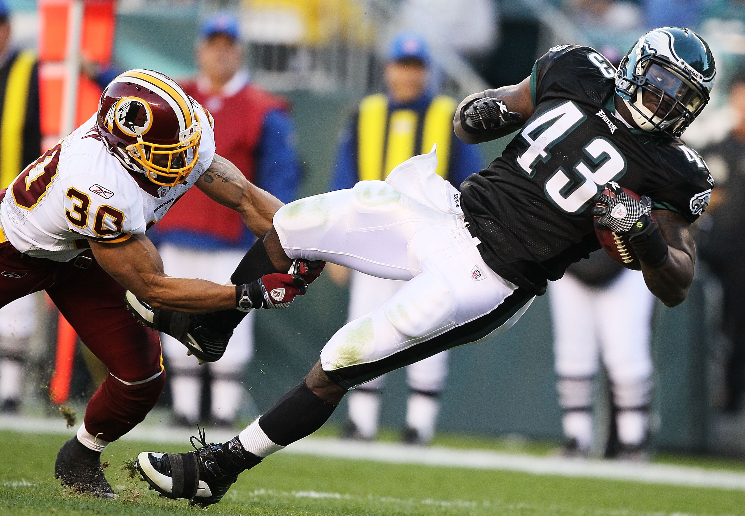 PHILADELPHIA - NOVEMBER 29: Leonard Weaver #43 of the Philadelphia Eagles is tackled by LaRon Landry #30 of the Washington Redskins during their game at Lincoln Financial Field on November 29, 2009 in Philadelphia, Pennsylvania. (Photo by Al Bello/Getty PHILADELPHIA - NOVEMBER 29: Leonard Weaver #43 of the Philadelphia Eagles is tackled by LaRon Landry #30 of the Washington Redskins during their game at Lincoln Financial Field on November 29, 2009 in Philadelphia, Pennsylvania. (Photo by Al Bello/Getty