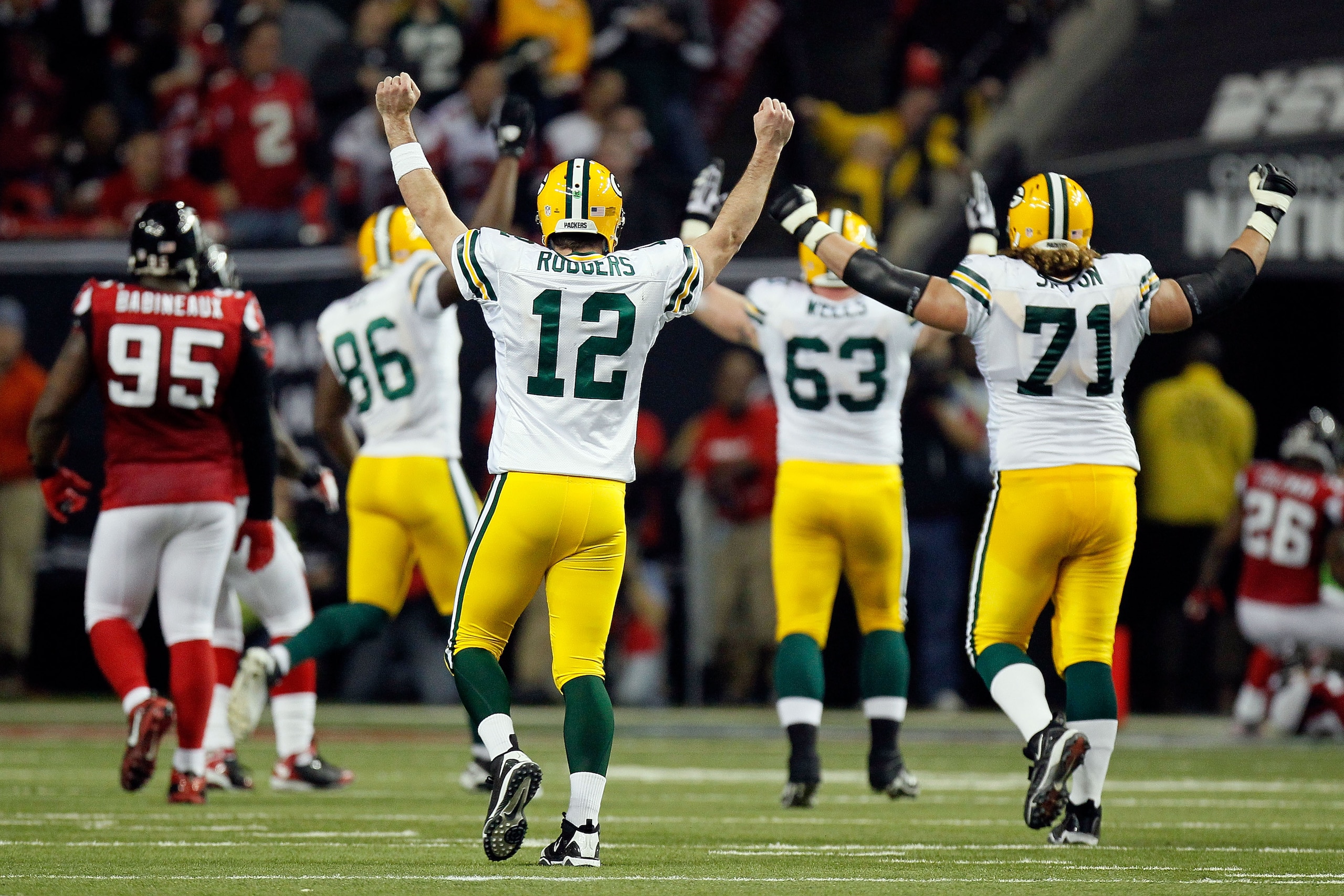 ATLANTA, GA - JANUARY 15: Aaron Rodgers #12 of the Green Bay Packers reacts after he threw a 20-yard touchdown pass to James Jones #89 against the Atlanta Falcons during their 2011 NFC divisional playoff game at Georgia Dome on January 15, 2011 in Atlant ATLANTA, GA - JANUARY 15: Aaron Rodgers #12 of the Green Bay Packers reacts after he threw a 20-yard touchdown pass to James Jones #89 against the Atlanta Falcons during their 2011 NFC divisional playoff game at Georgia Dome on January 15, 2011 in Atlant